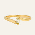 Slim 10k yellow gold bypass ring with a single marquise diamond set on the diagonal where the band crosses