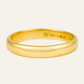 Simple 3.3mm domed 18k yellow gold band, high polish, hallmarks stamped inside