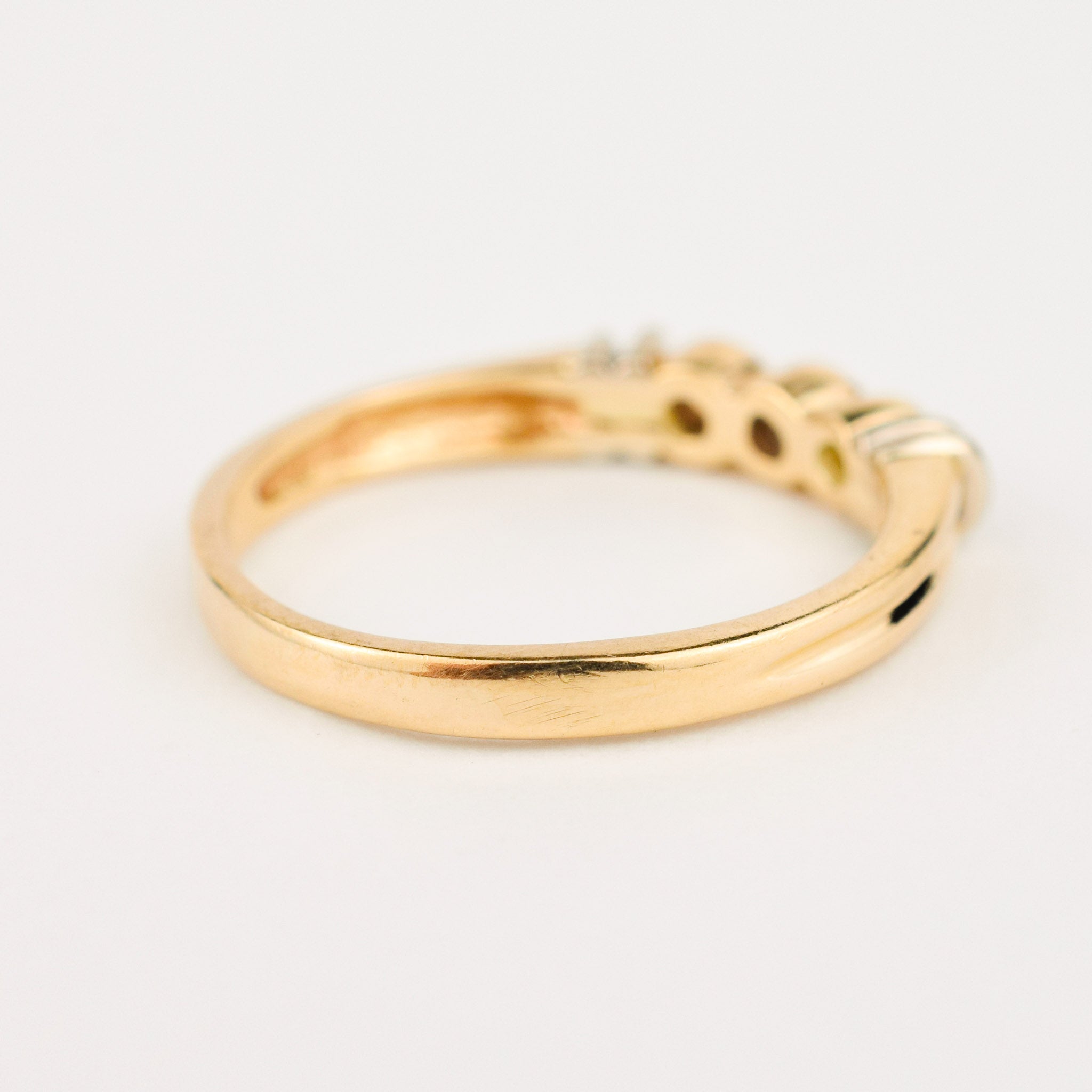vintage gold bezel set diamond trilogy ring 