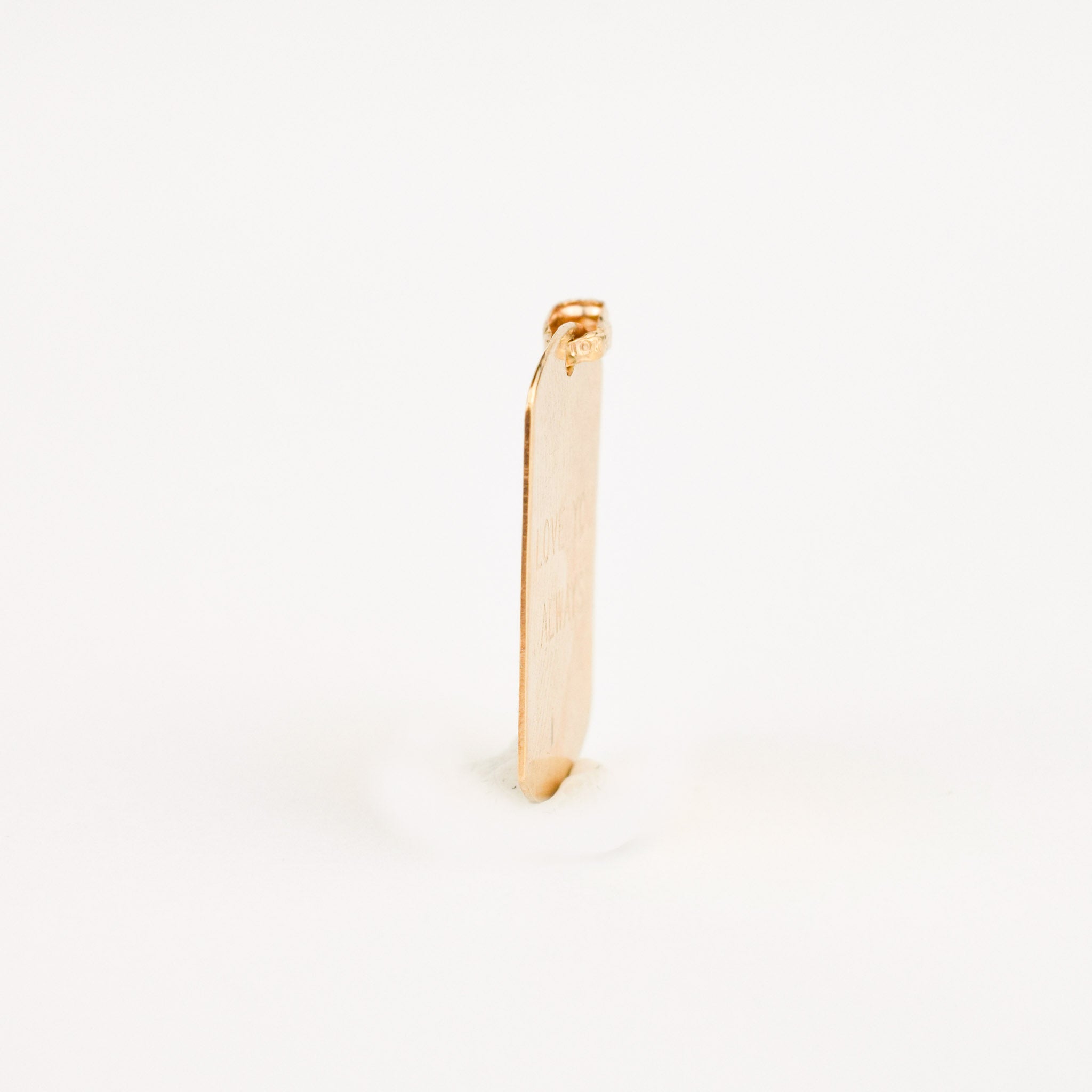 vintage gold dog tag charm 
