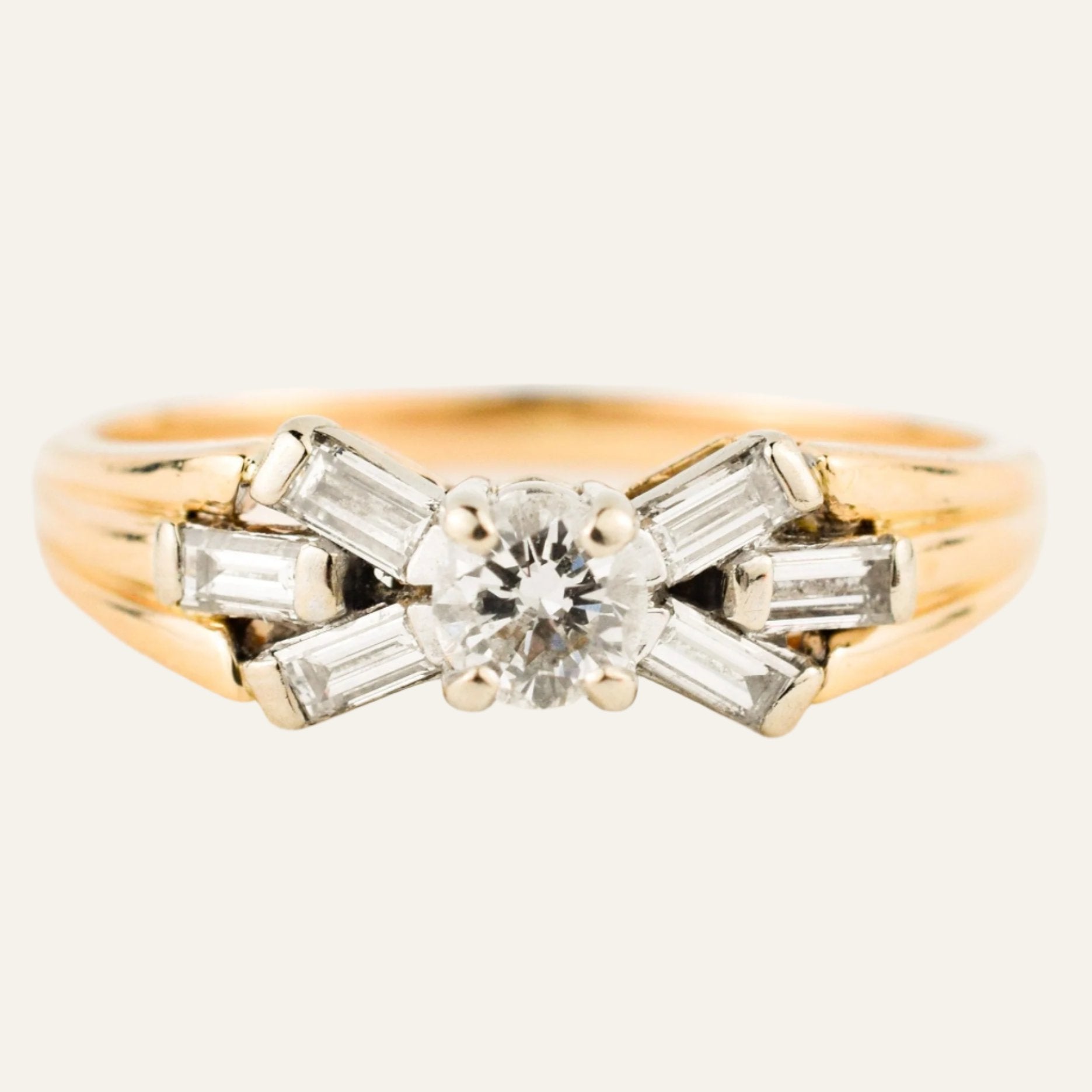 vintage engagement ring with baguette diamonds on band