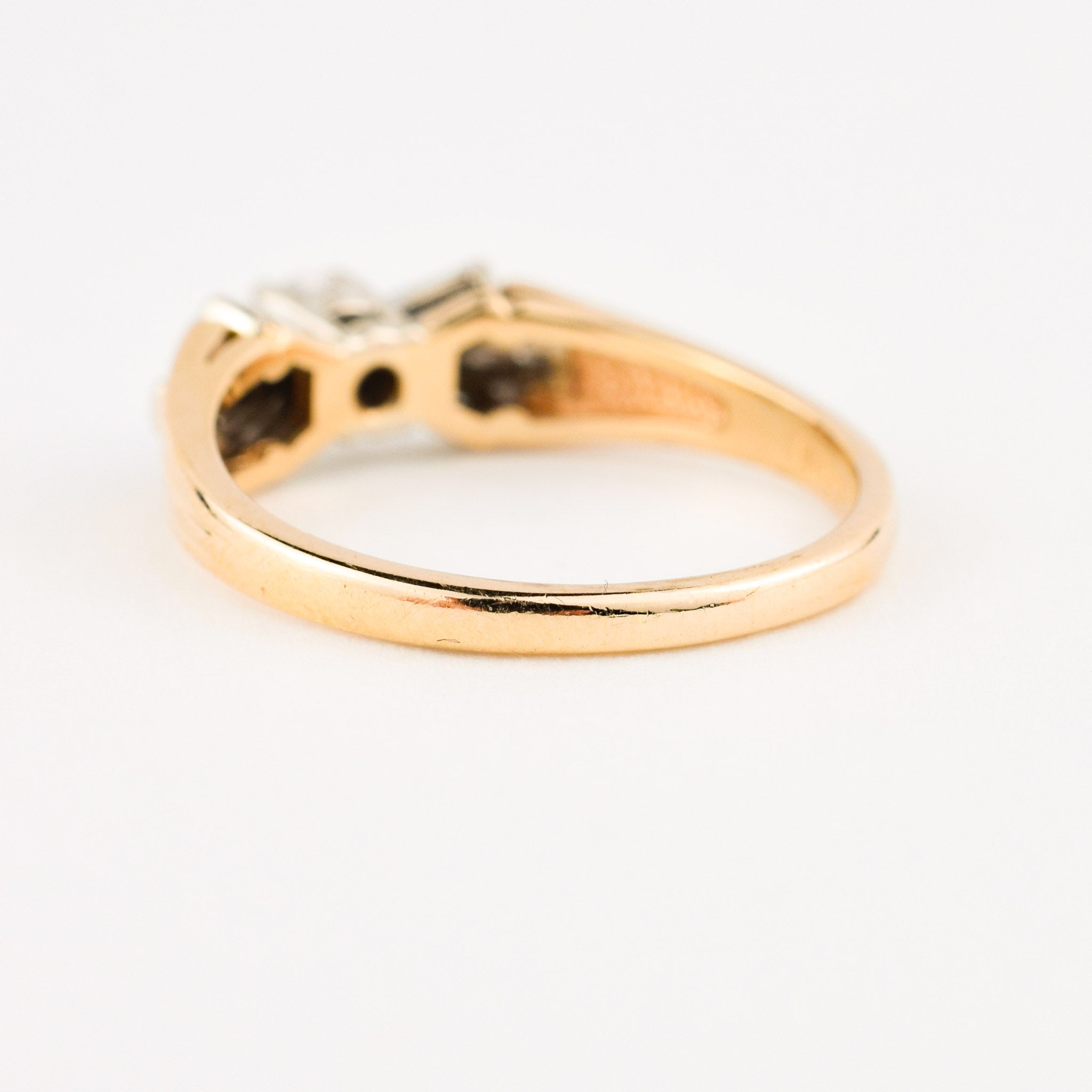 vintage engagement ring with baguette diamonds on band