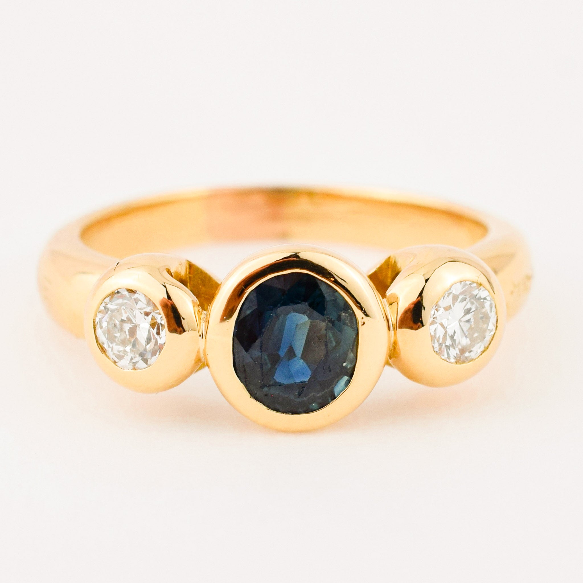 bezel set diamond and sapphire trilogy ring