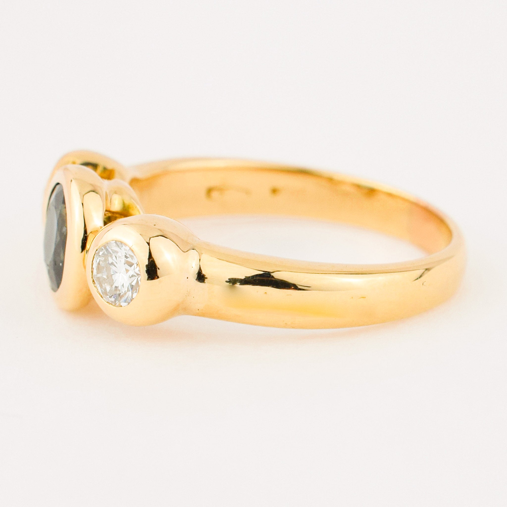 bezel set diamond and sapphire trilogy ring