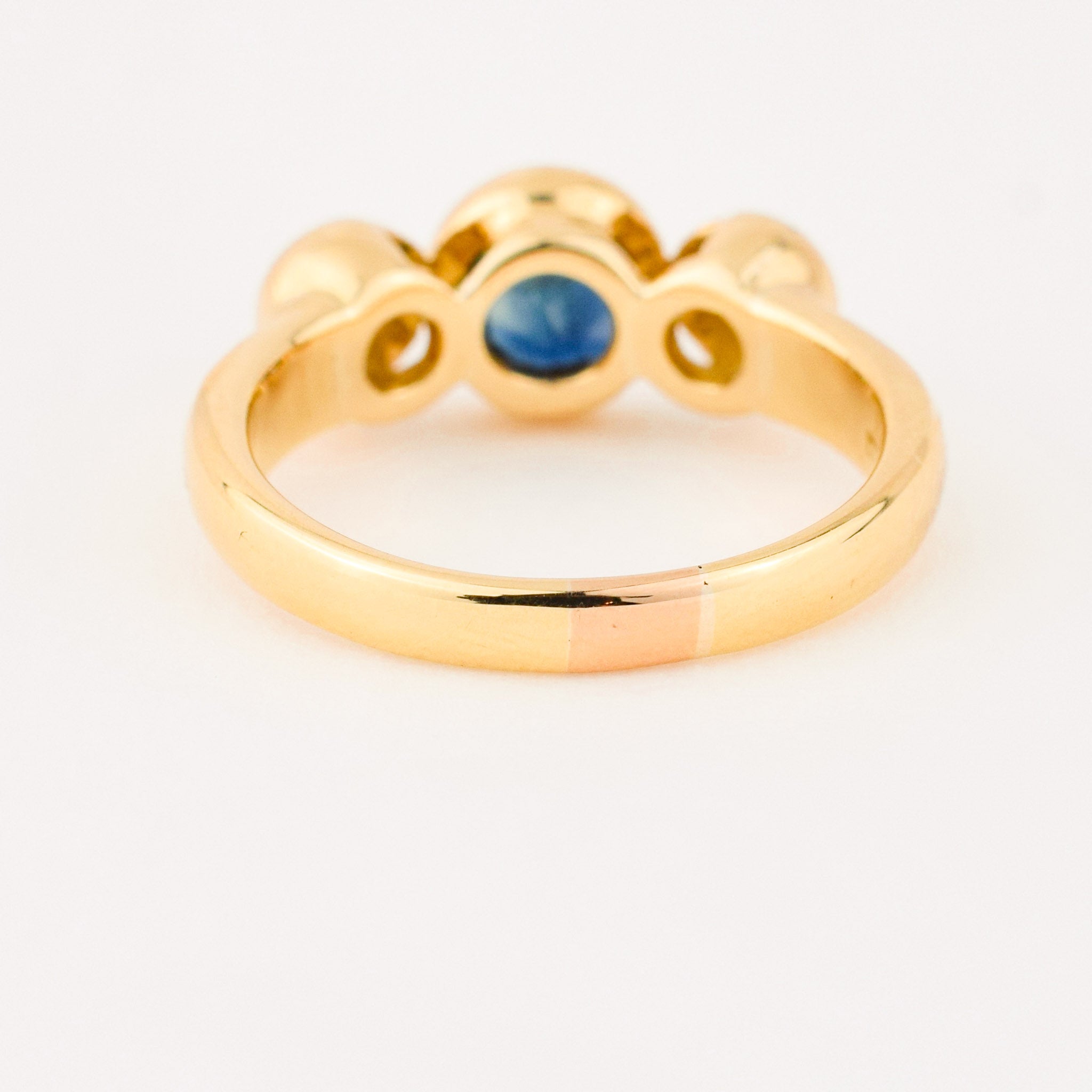 bezel set diamond and sapphire trilogy ring
