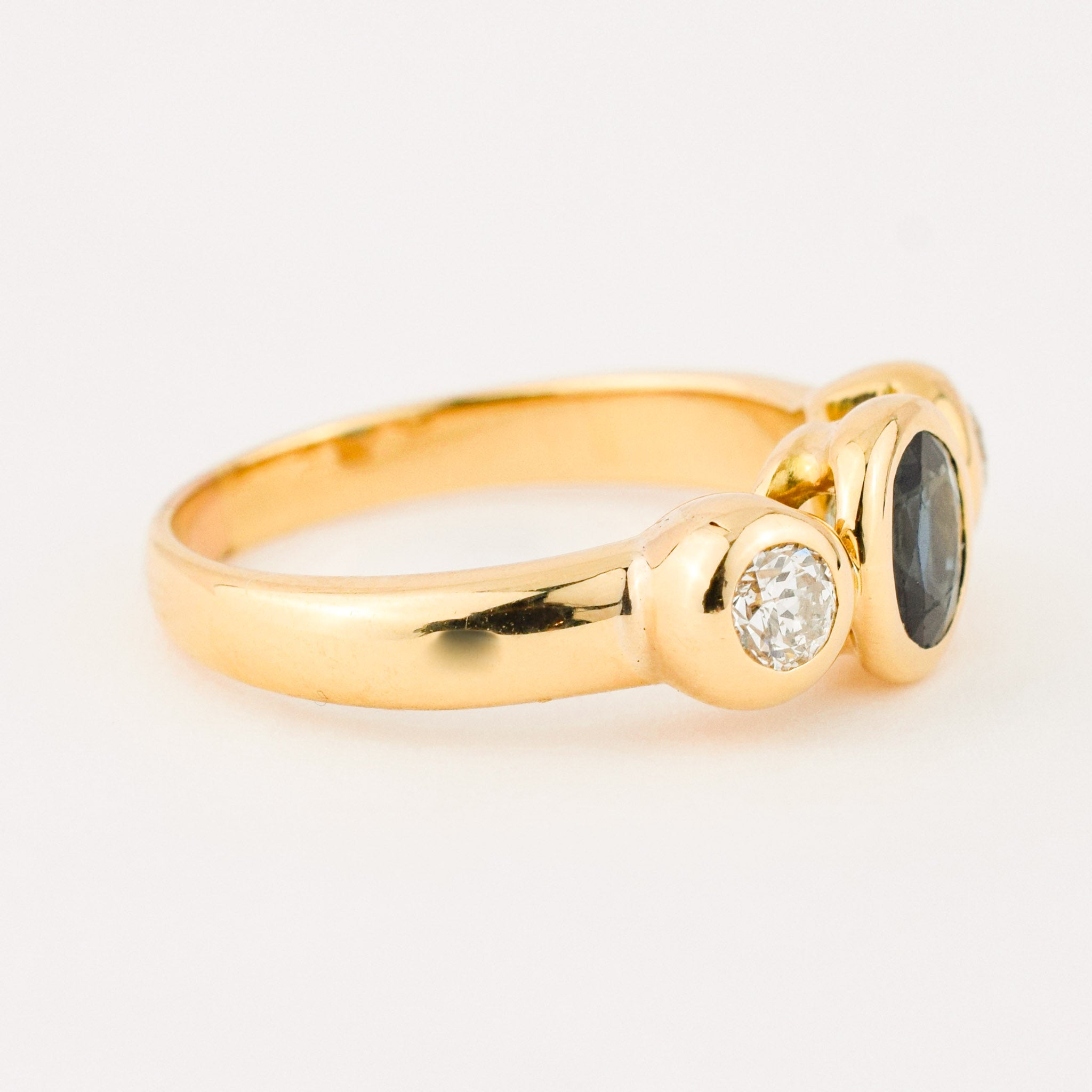 bezel set diamond and sapphire trilogy ring