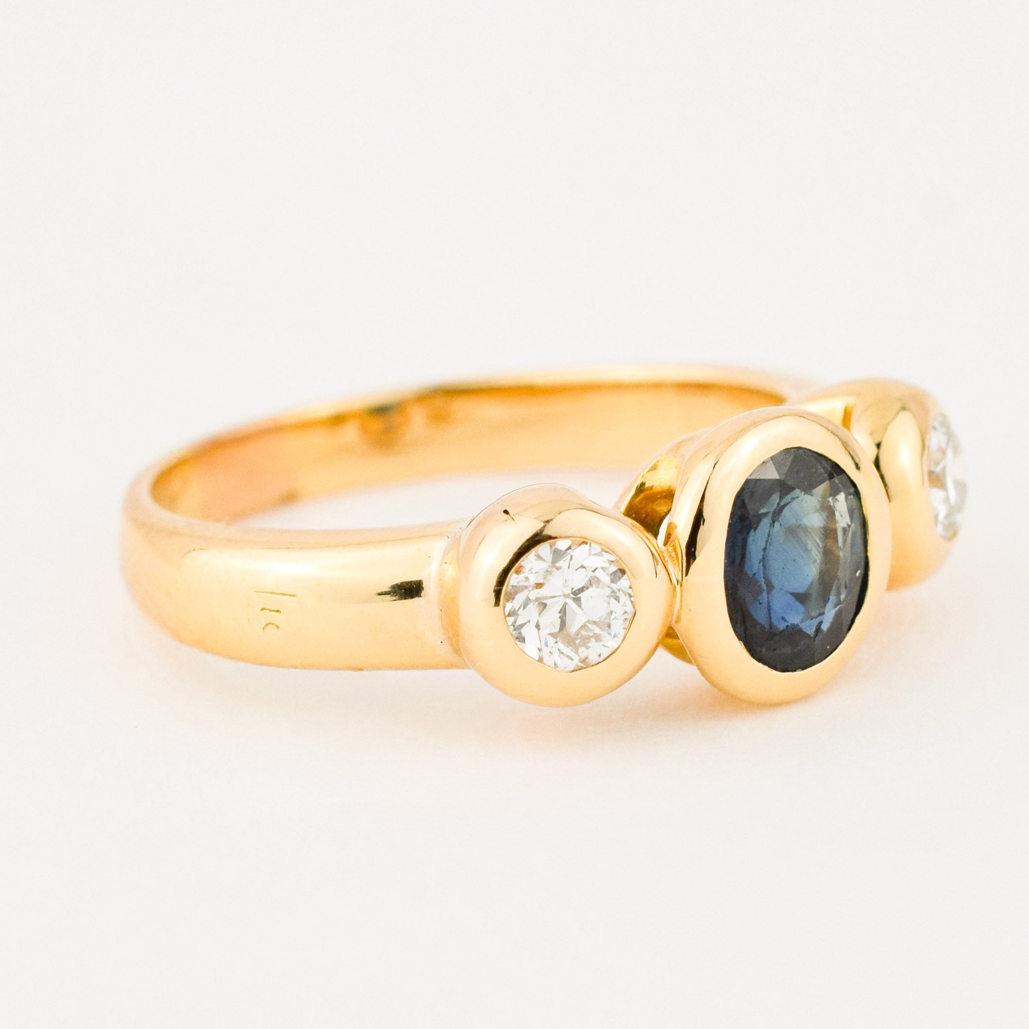 bezel set diamond and sapphire trilogy ring