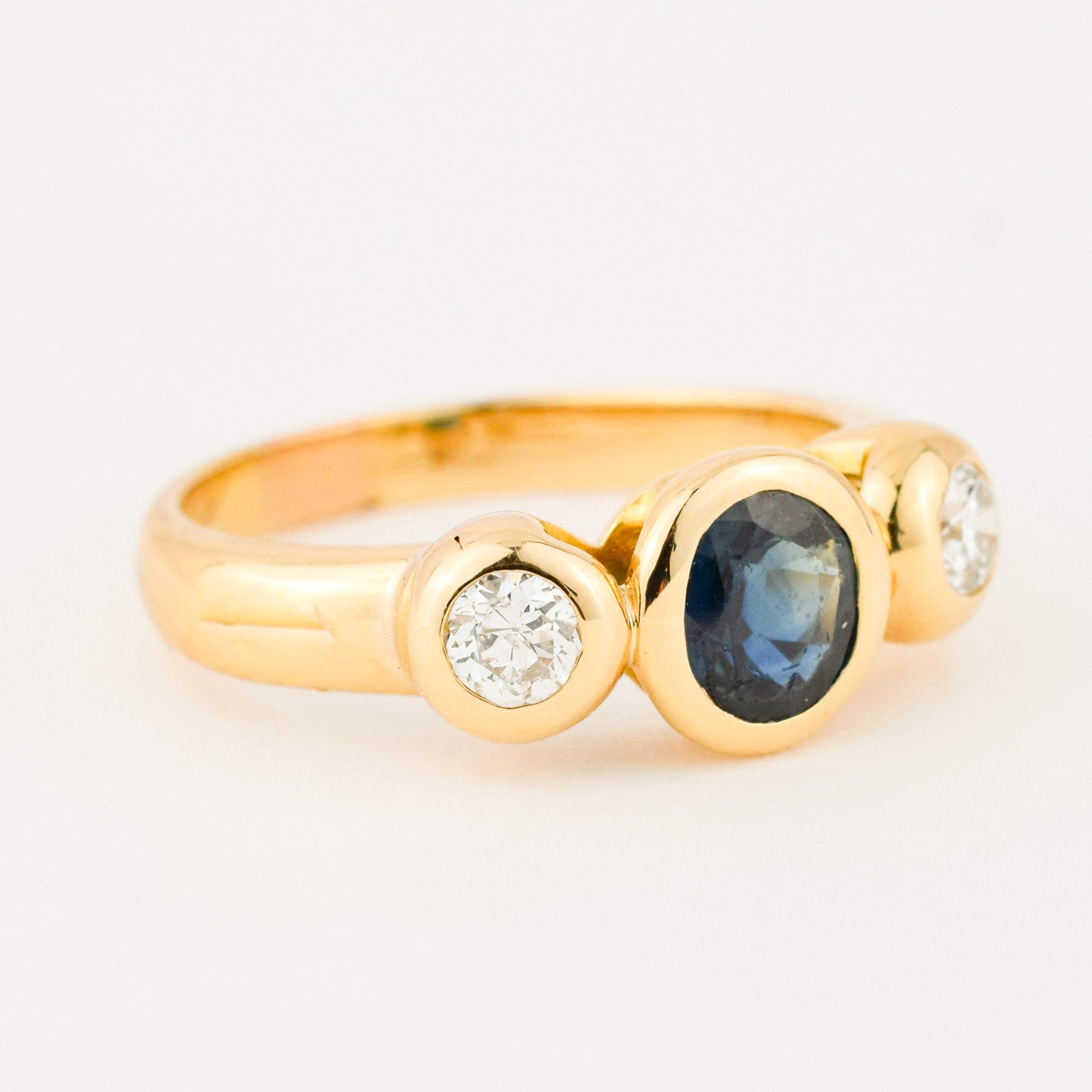 bezel set diamond and sapphire trilogy ring