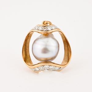 vintage gold baroque pearl pendant with brilliant cut diamonds