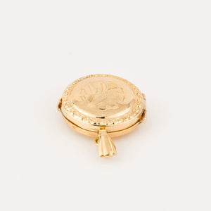 vintage gold circular locket 