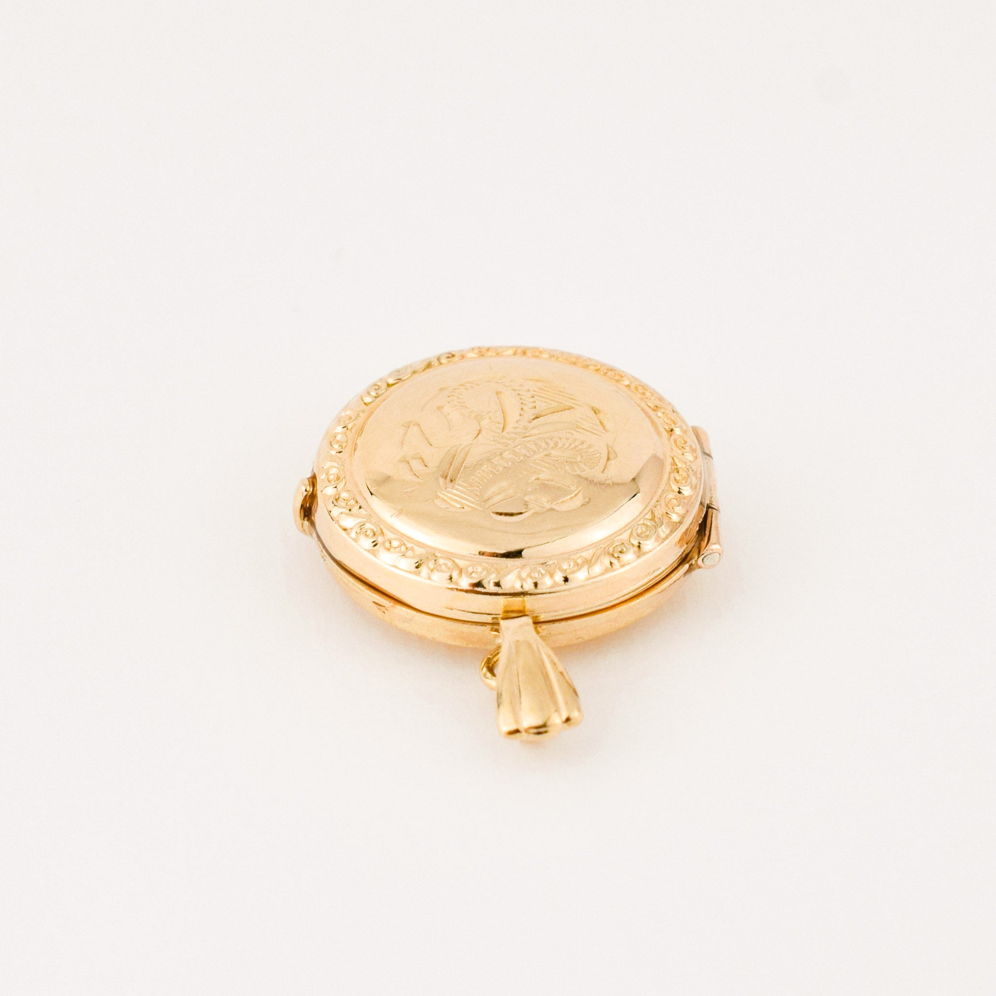vintage gold circular locket 