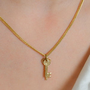 vintage gold double key charm pendant