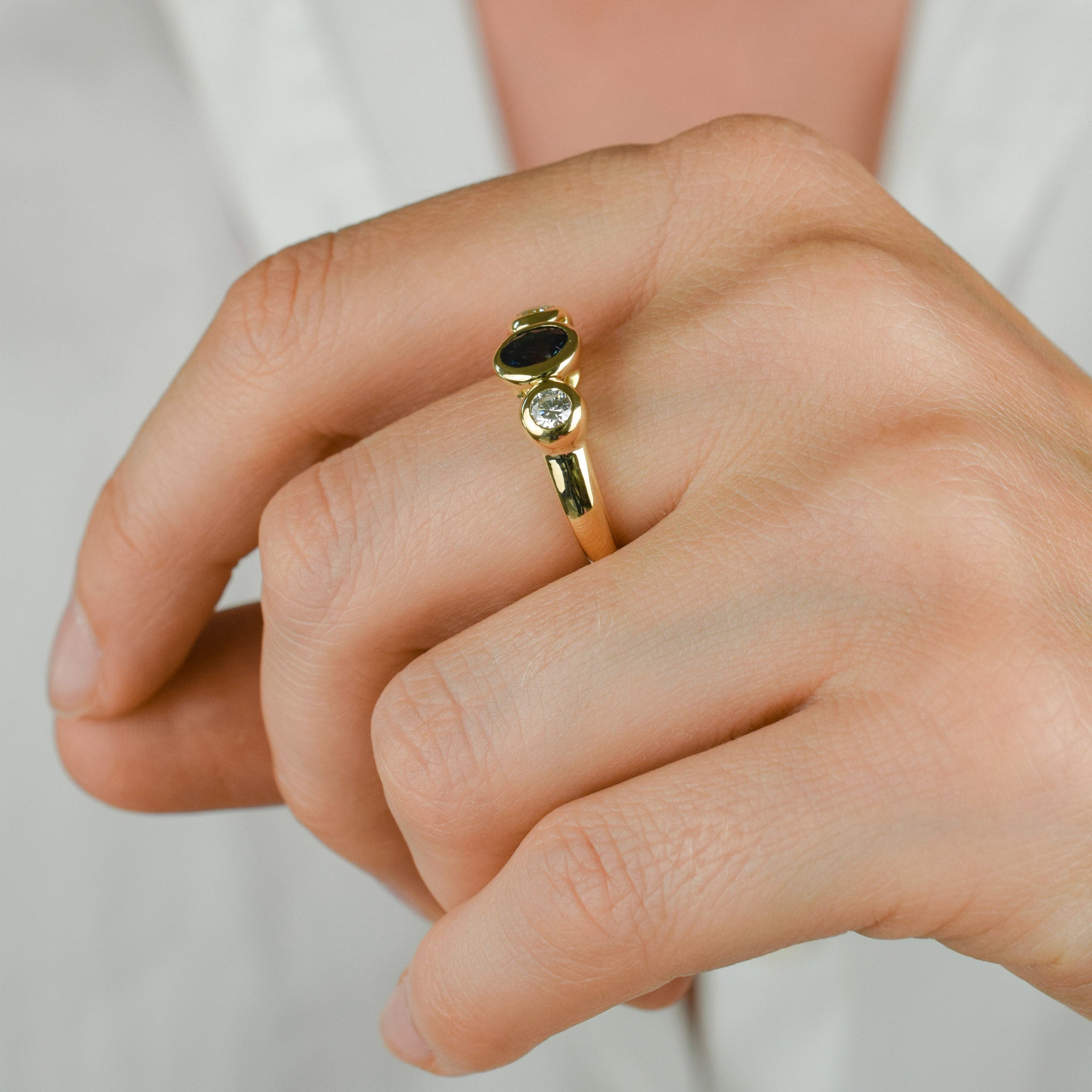 bezel set diamond and sapphire trilogy ring