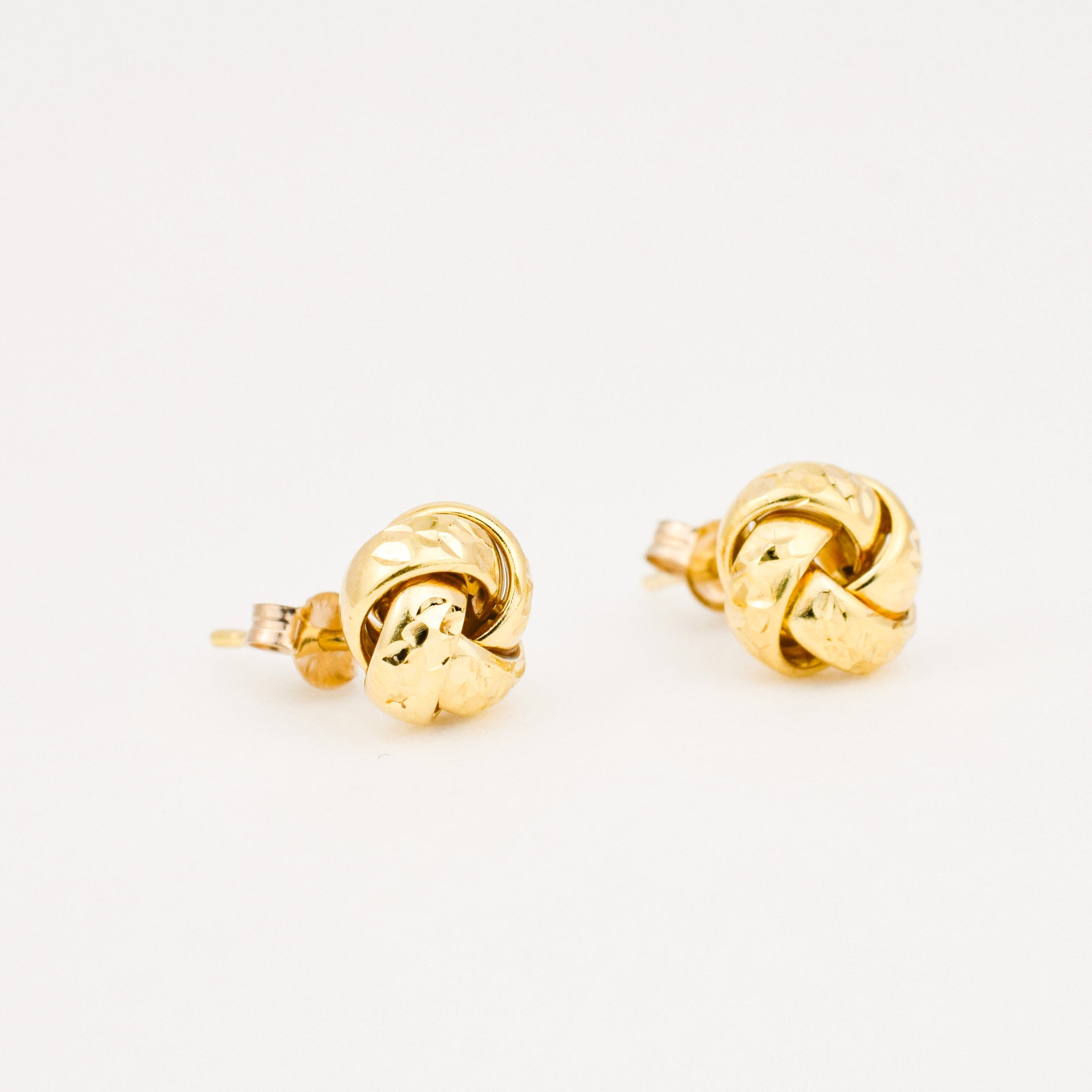 vintage gold diamond cut love knot stud earrings