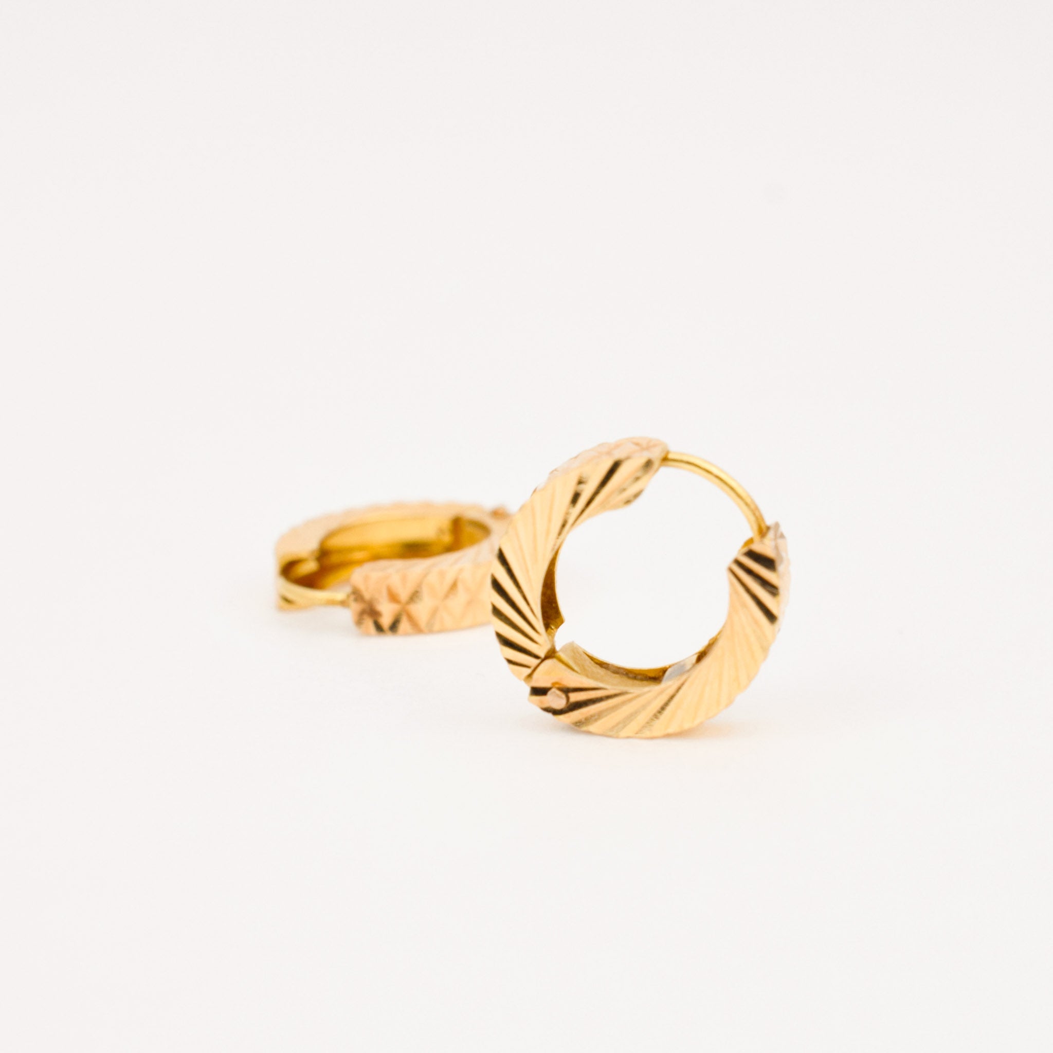 diamond cut gold huggie hoop earrings