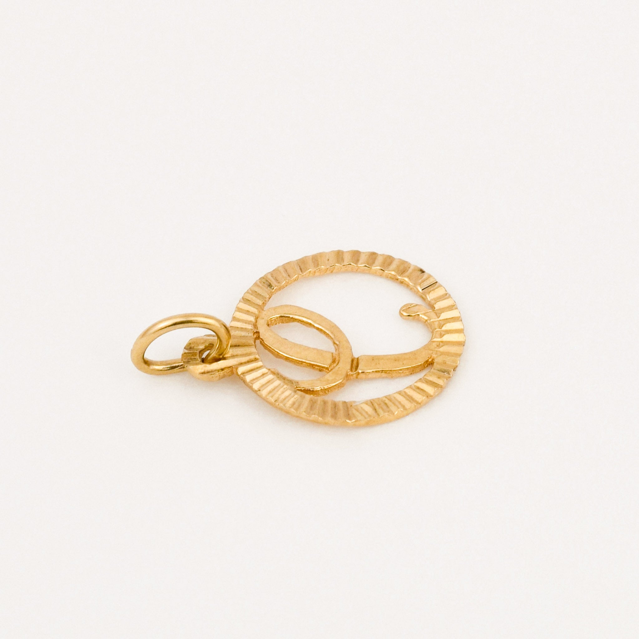 vintage gold circular 'c' charm 