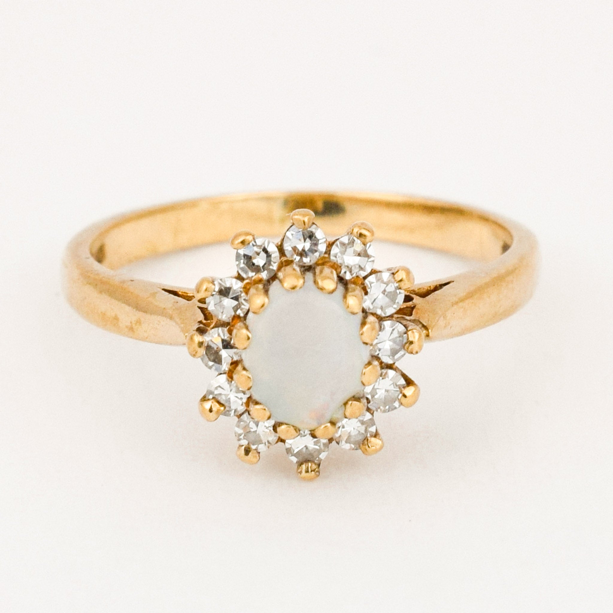 vintage gold opal and diamond halo ring 