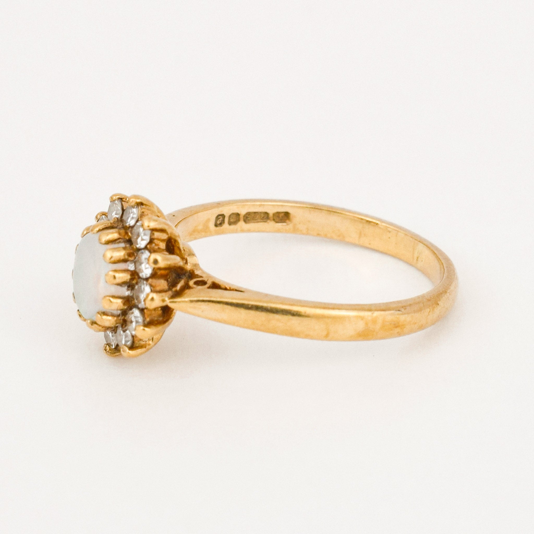 vintage gold opal and diamond halo ring 