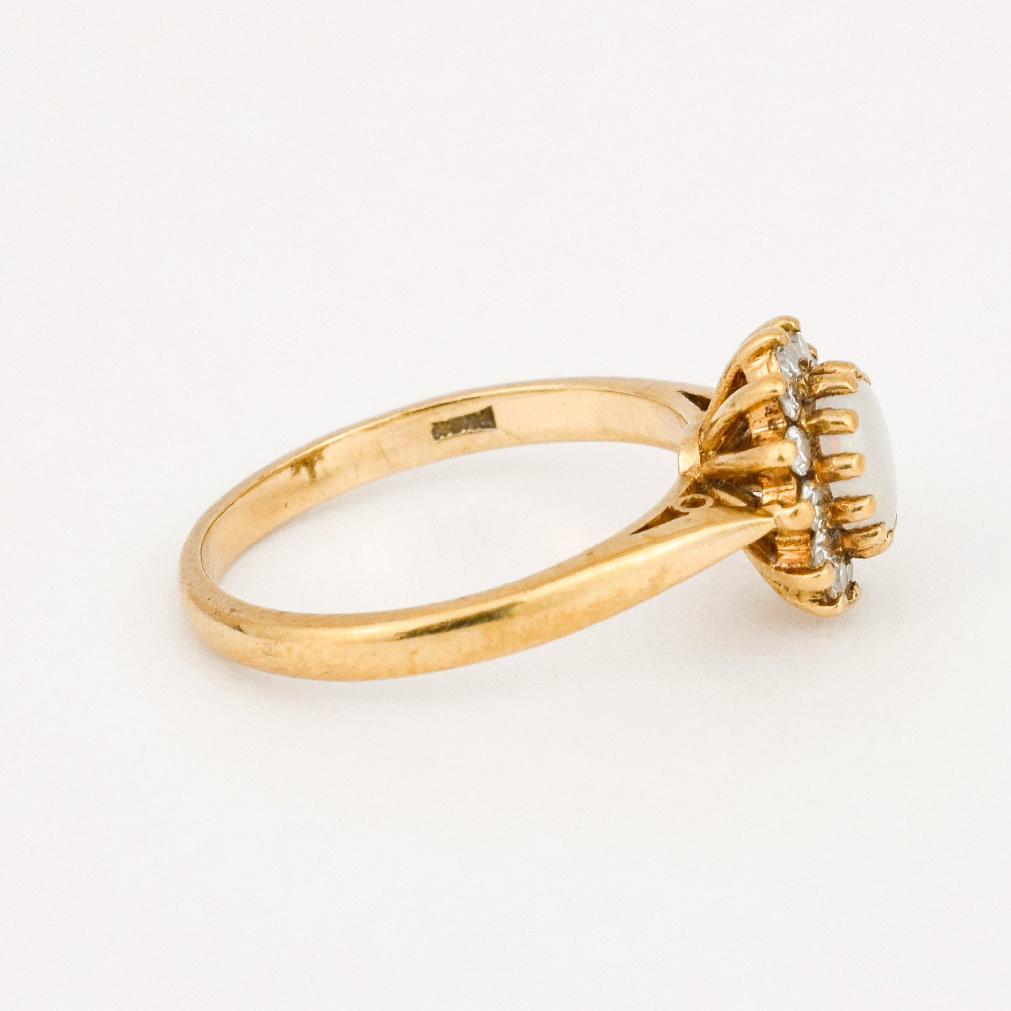 vintage gold opal and diamond halo ring 