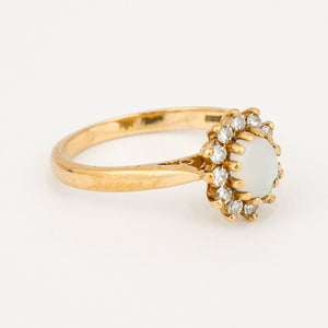 vintage gold opal and diamond halo ring 