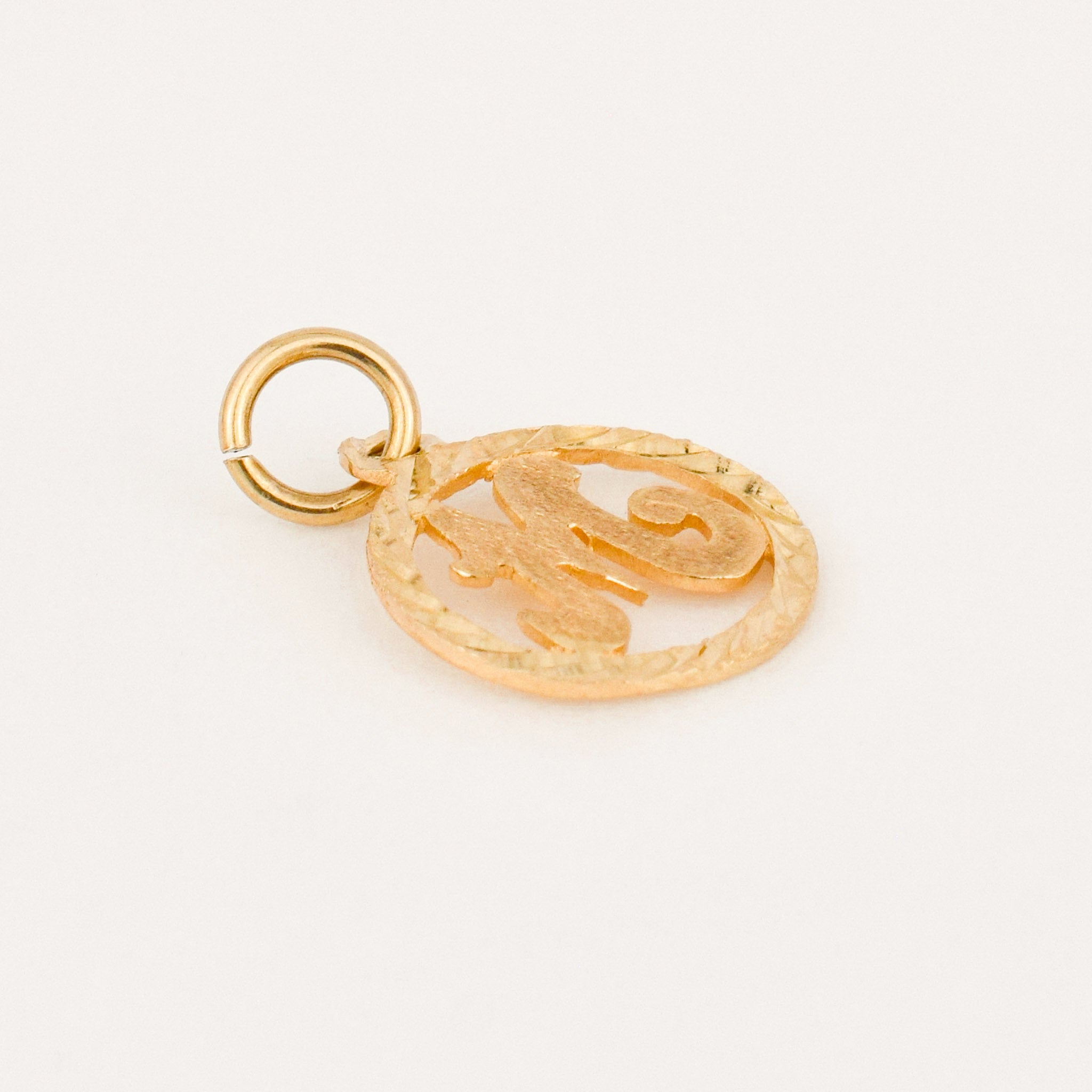circular 'm' charm 