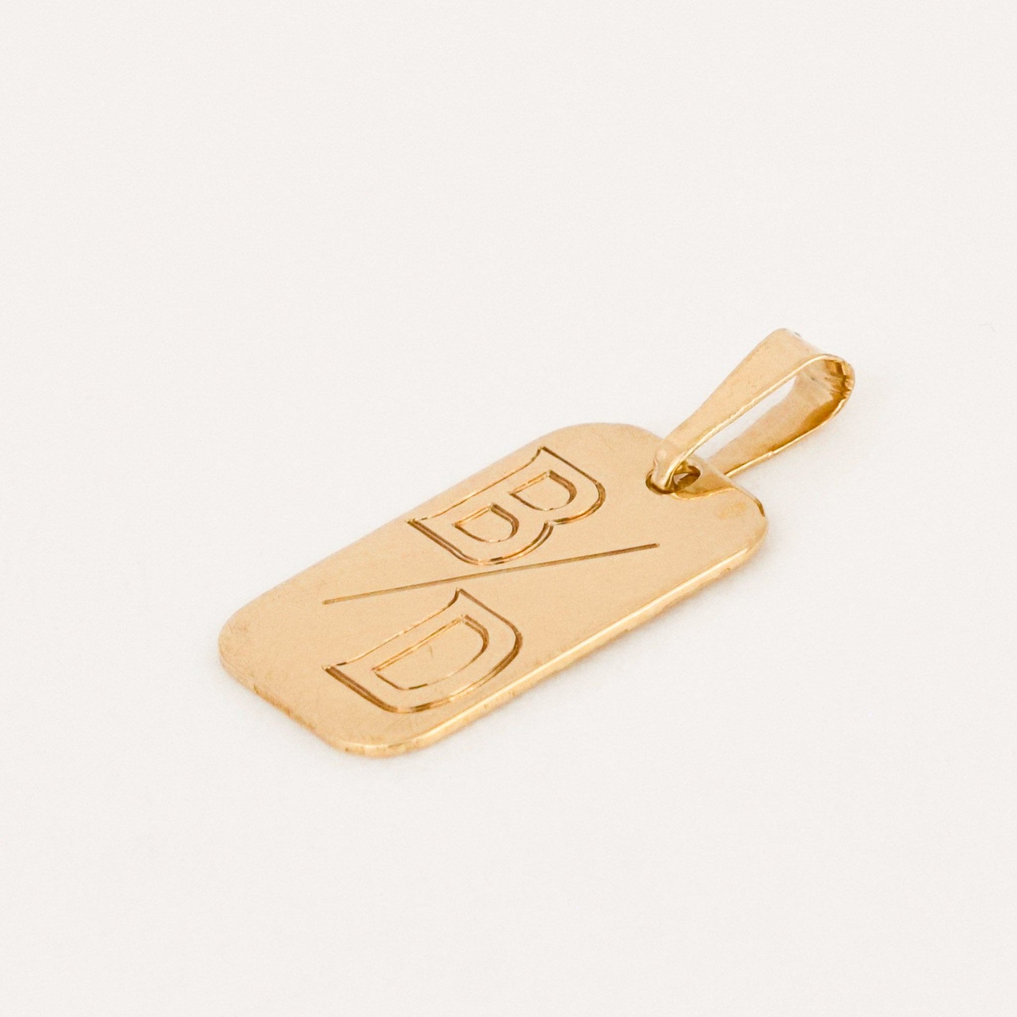 vintage gold 'b/d' dog tag pendant 