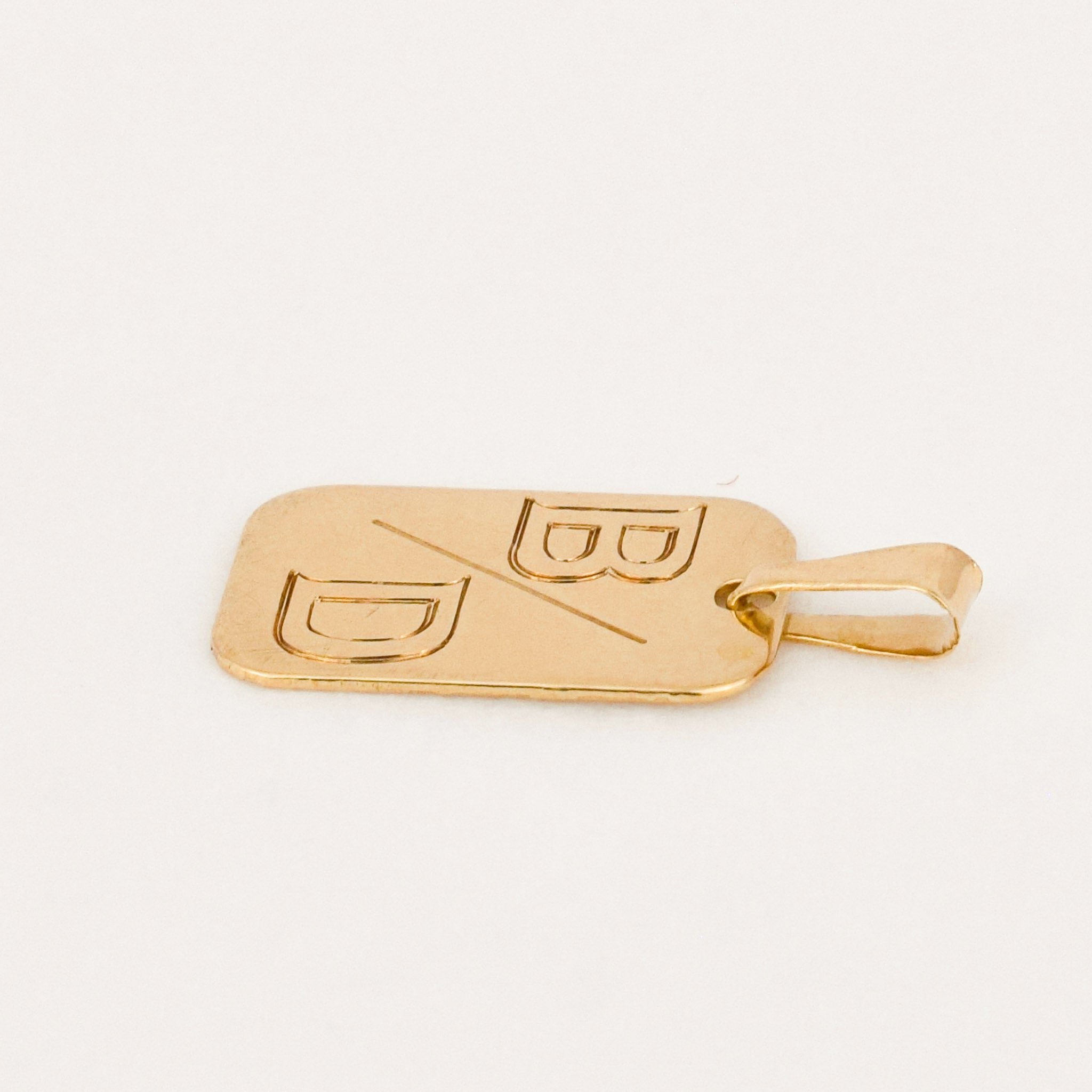 vintage gold 'b/d' dog tag pendant 