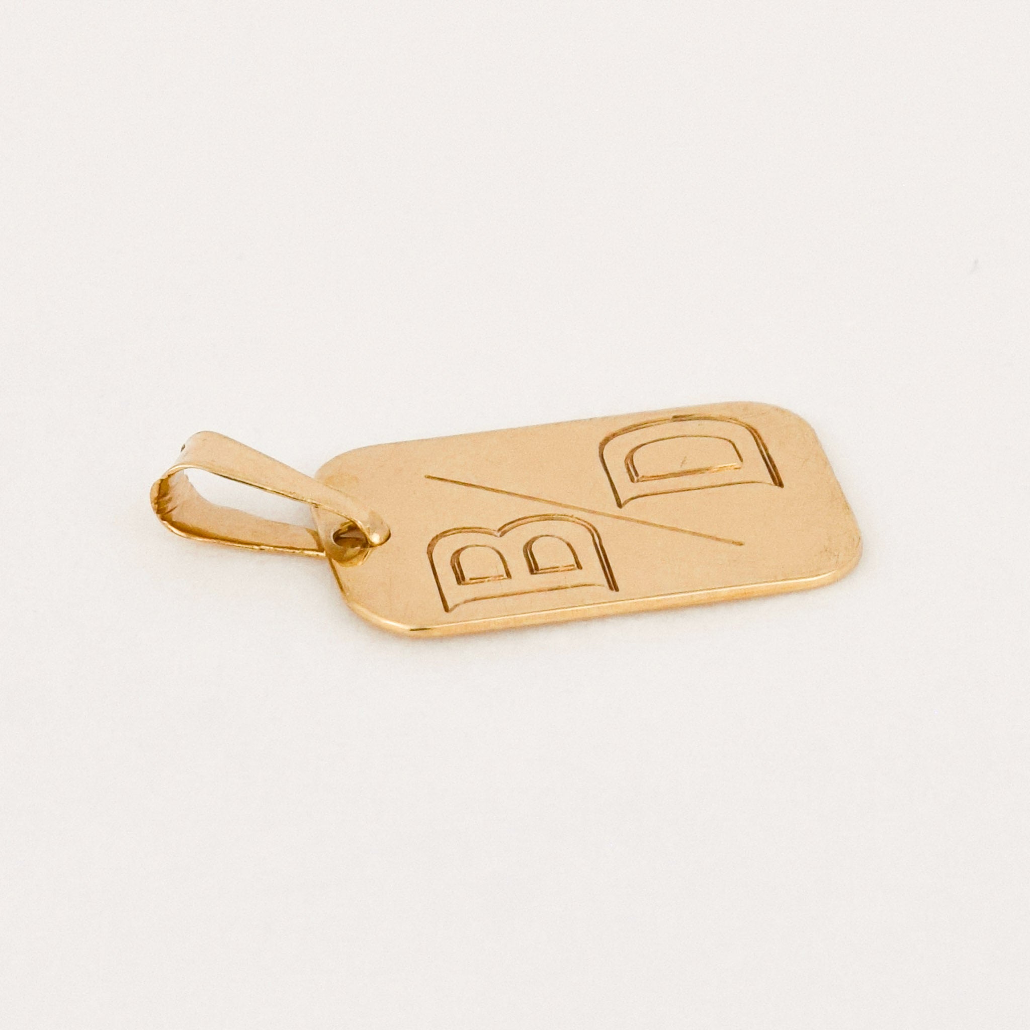 vintage gold 'b/d' dog tag pendant 