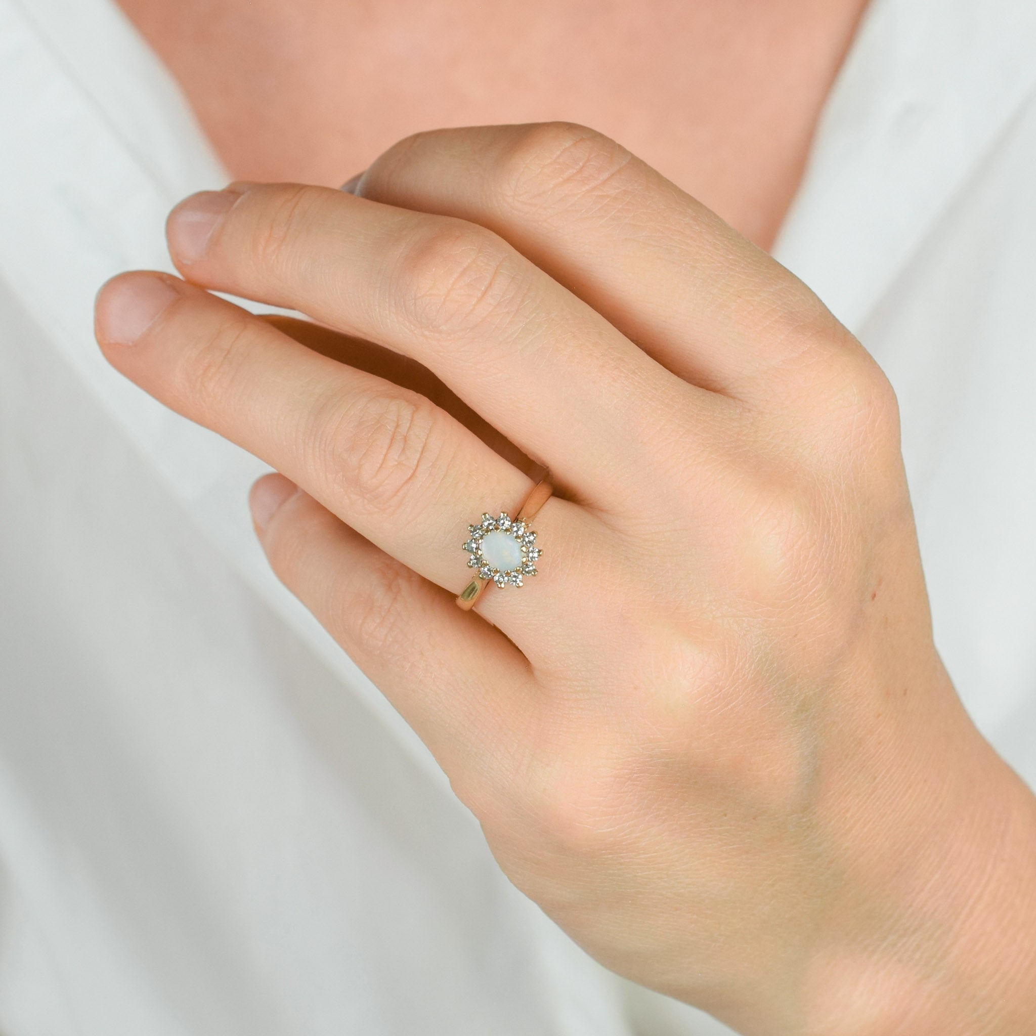 vintage gold opal and diamond halo ring 