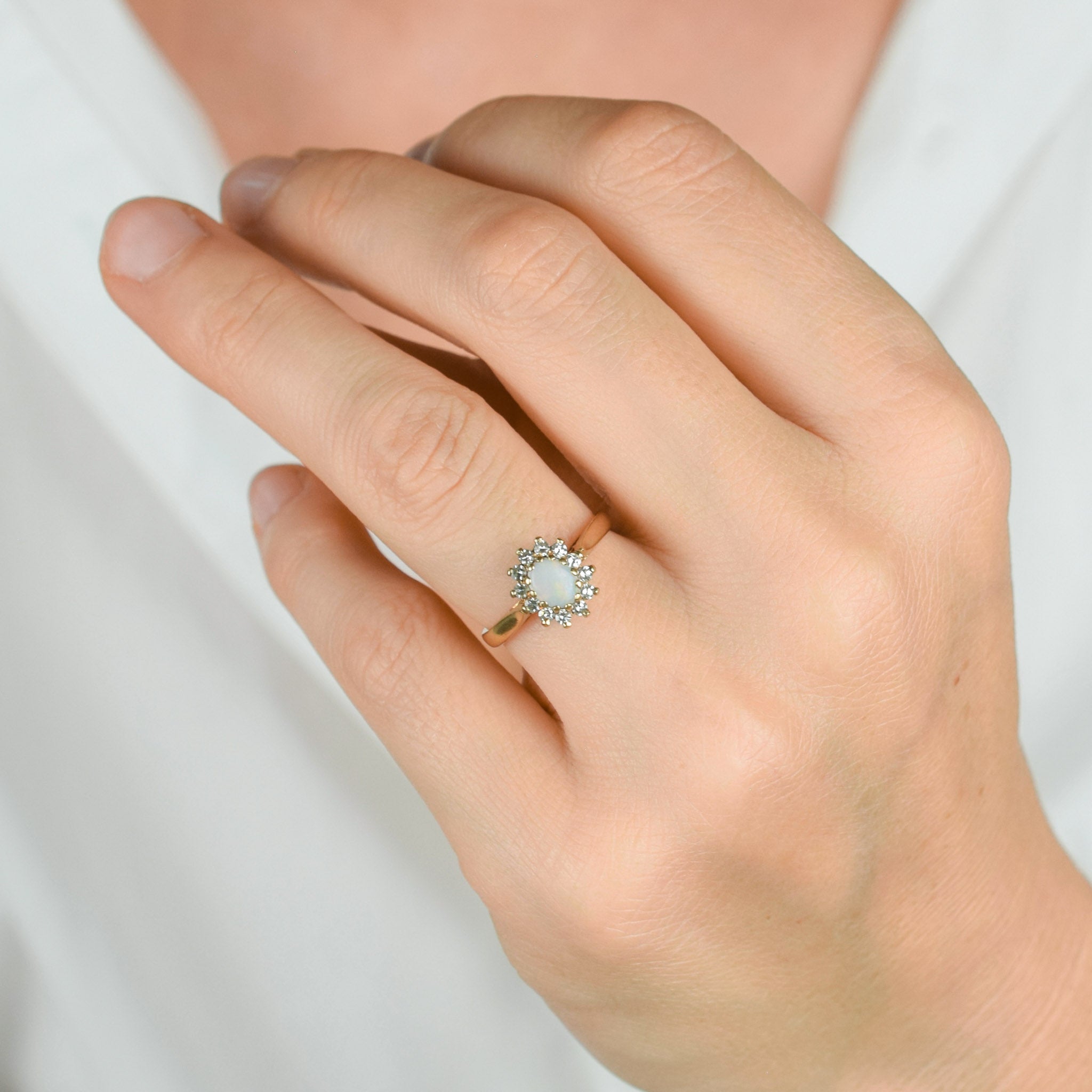 vintage gold opal and diamond halo ring 