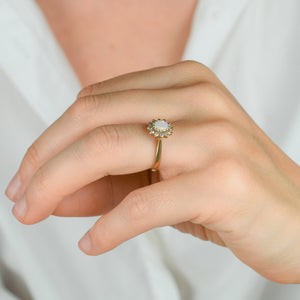 vintage gold opal and diamond halo ring 