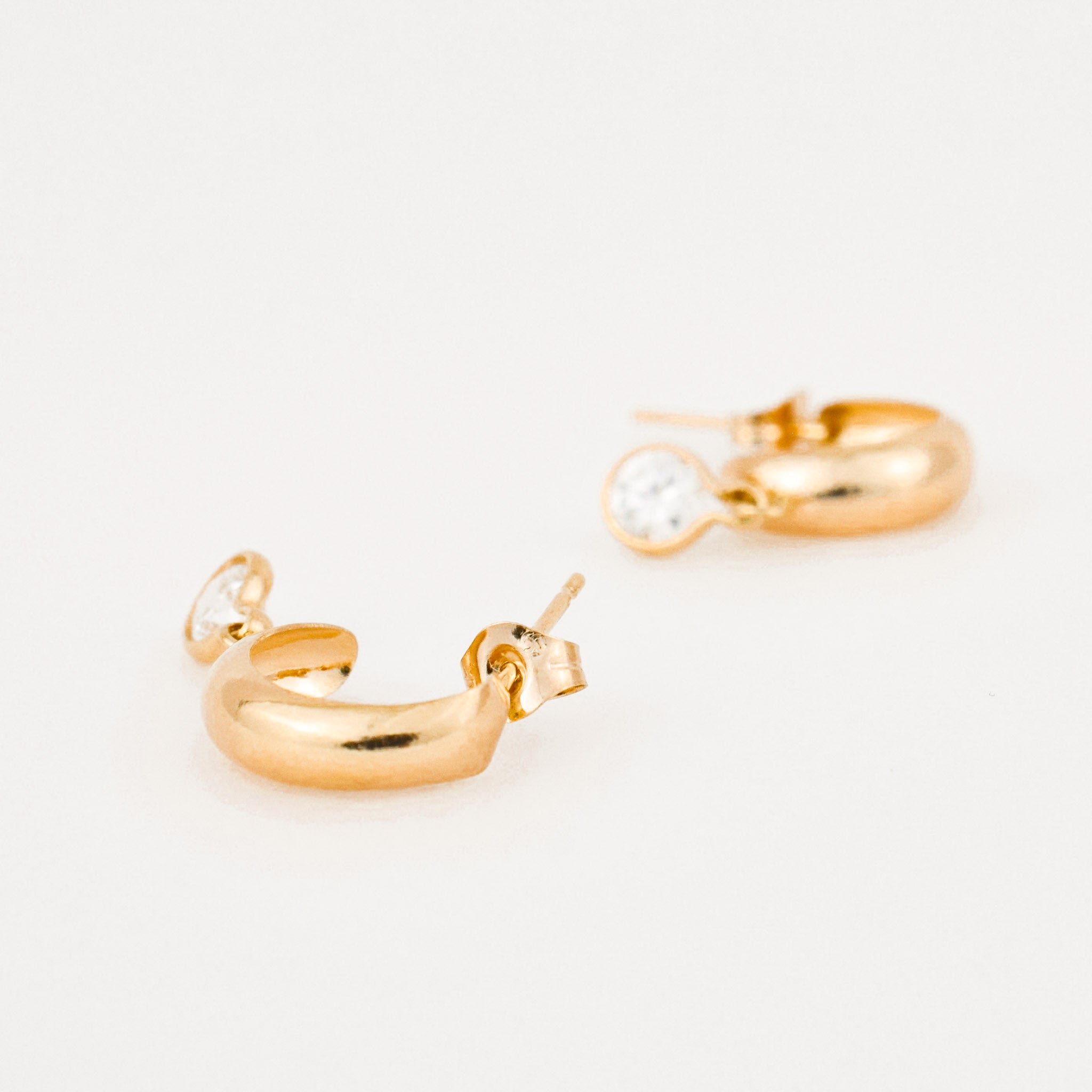 vintage gold half hoops with white stone earrings