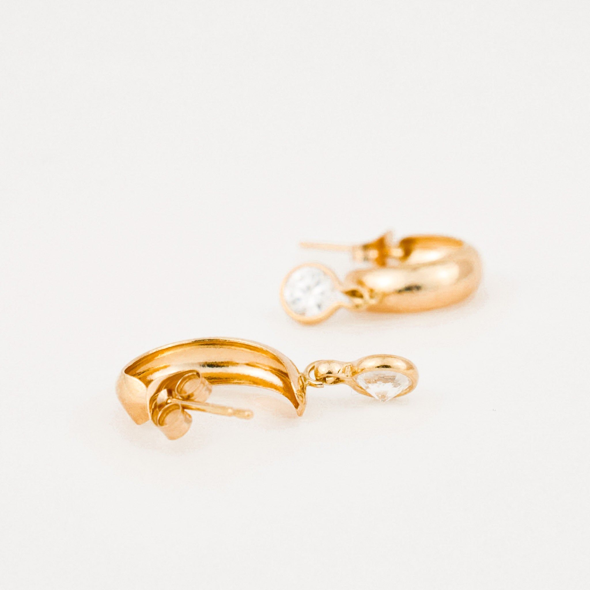 vintage gold half hoops with white stone earrings