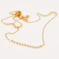 vintage gold static ball necklace