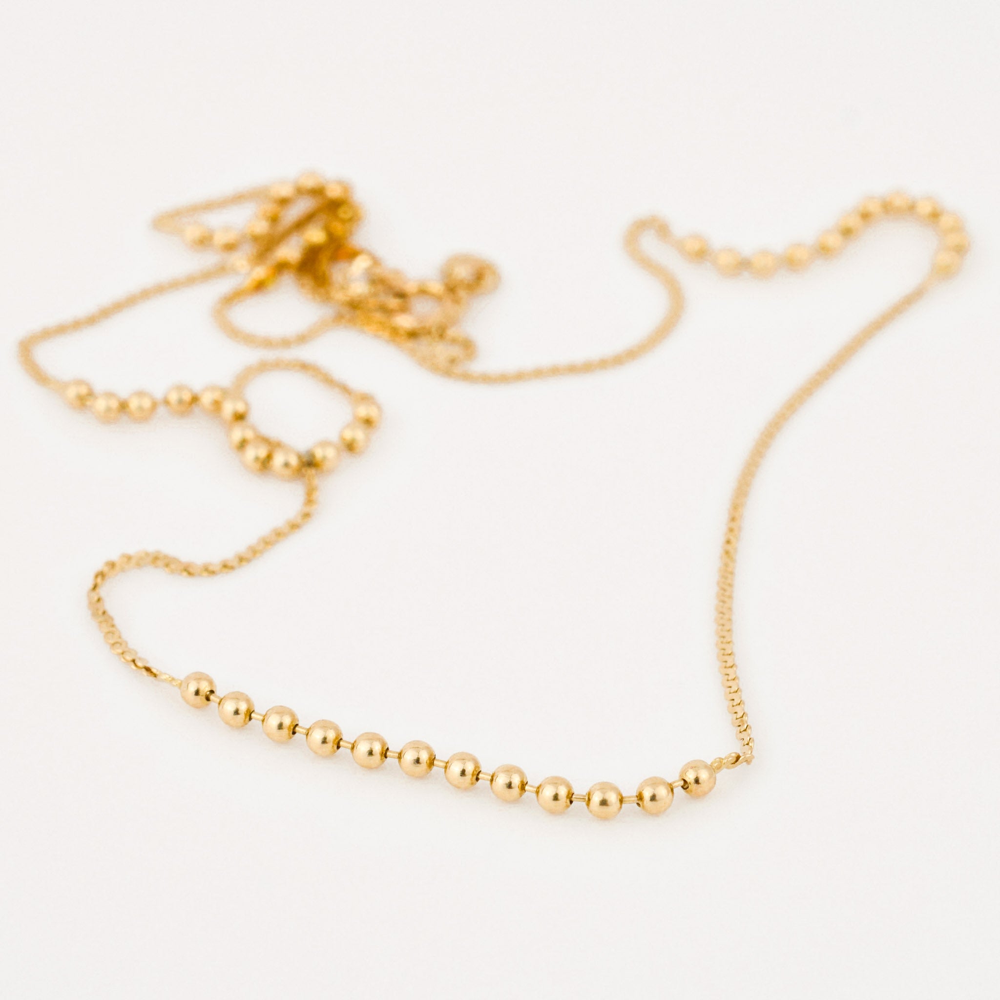 vintage gold static ball necklace