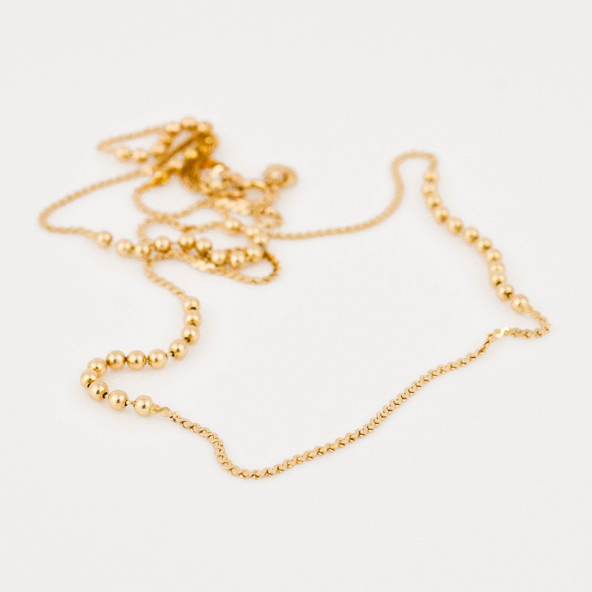 vintage gold static ball necklace