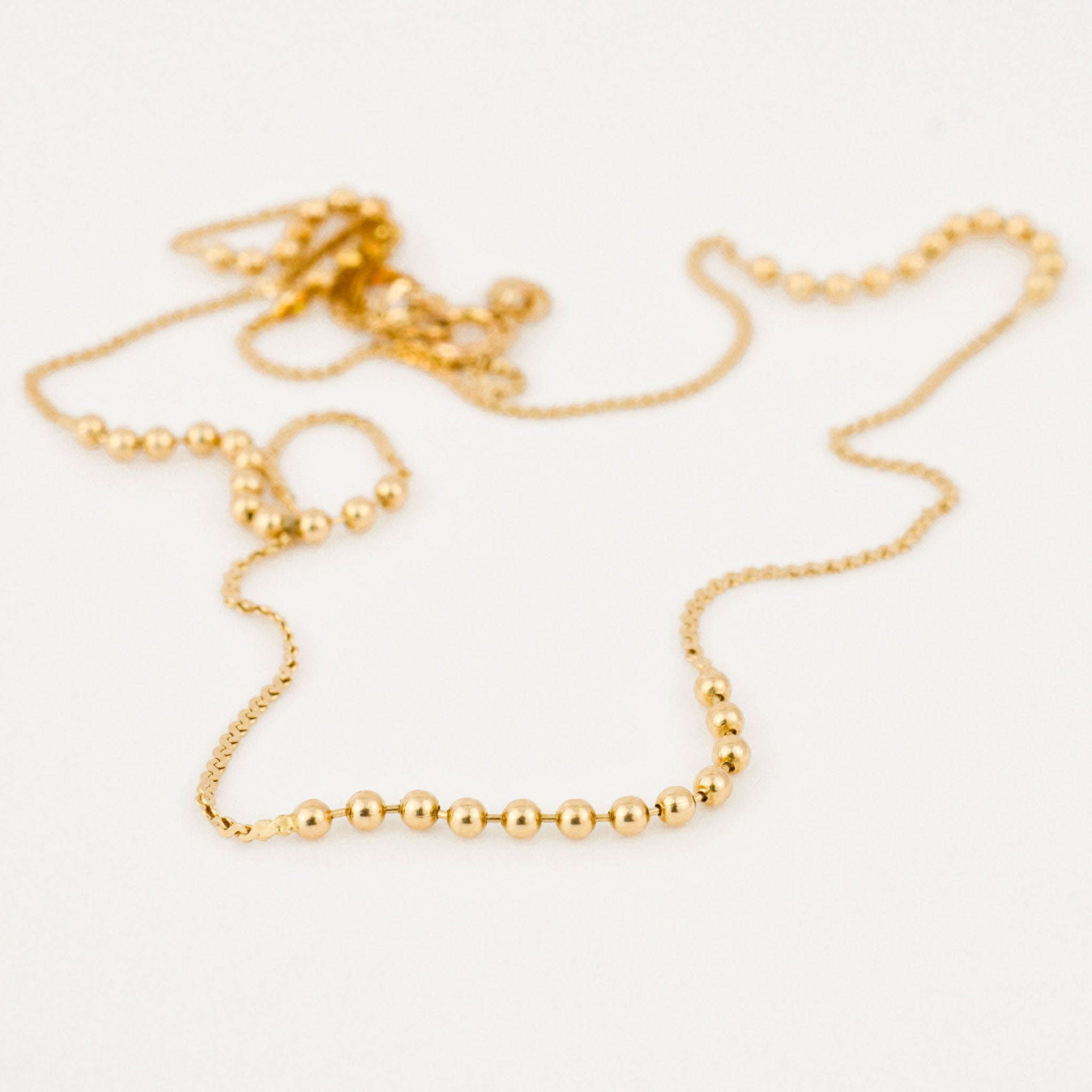 vintage gold static ball necklace