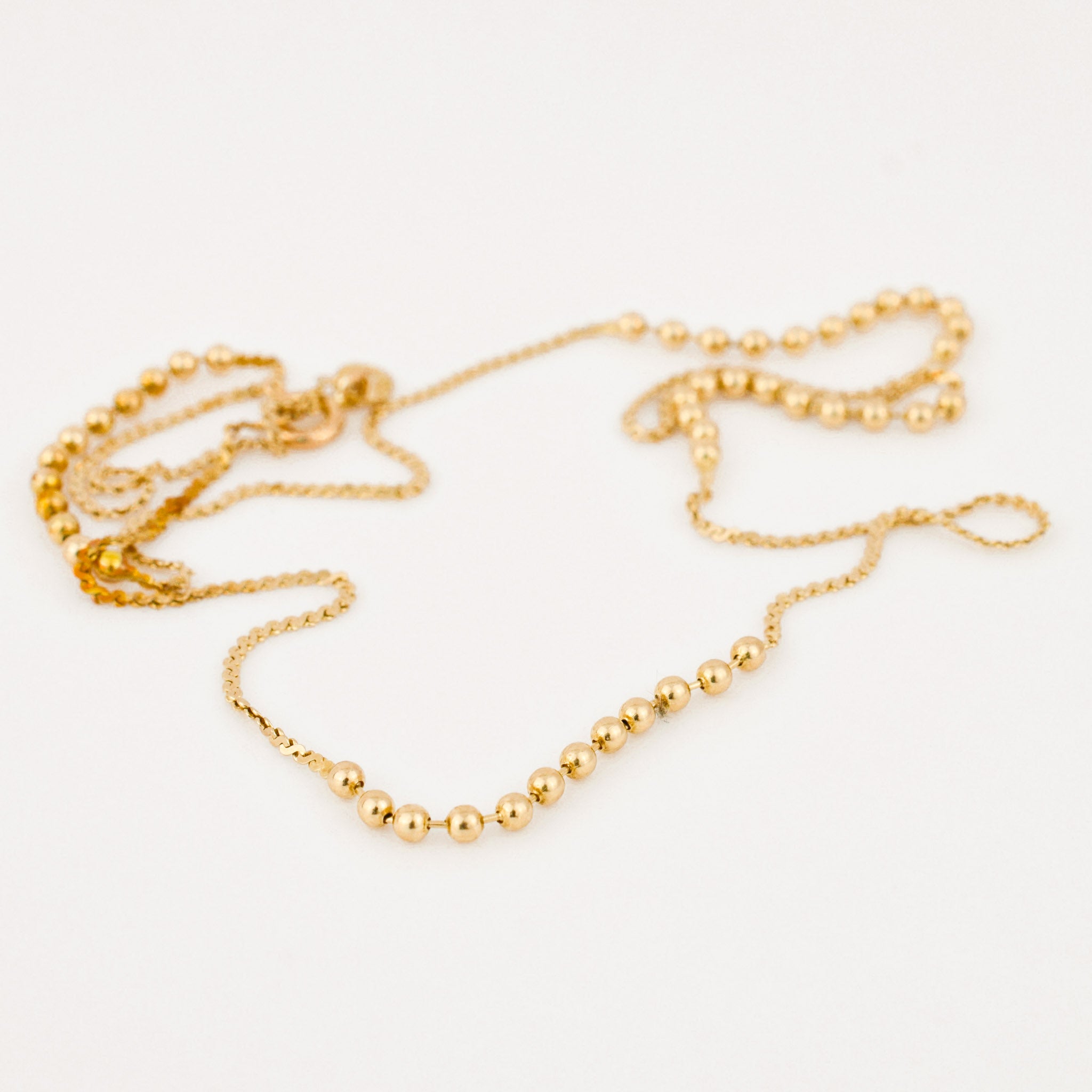 vintage gold static ball necklace