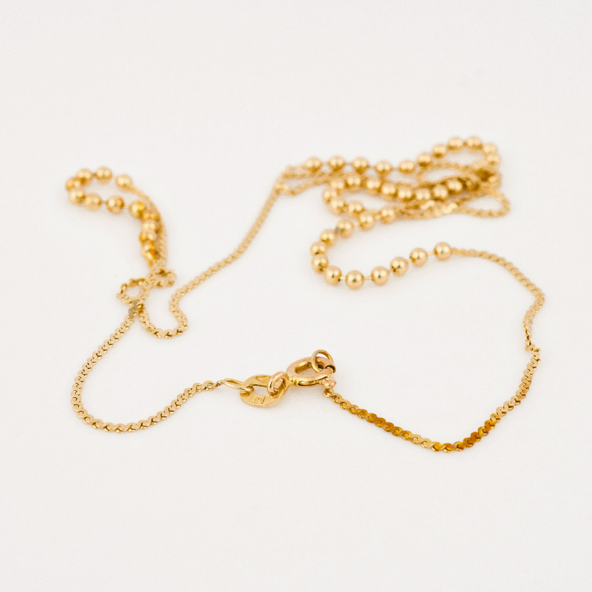 vintage gold static ball necklace