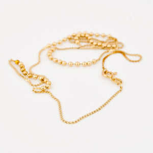 vintage gold static ball necklace