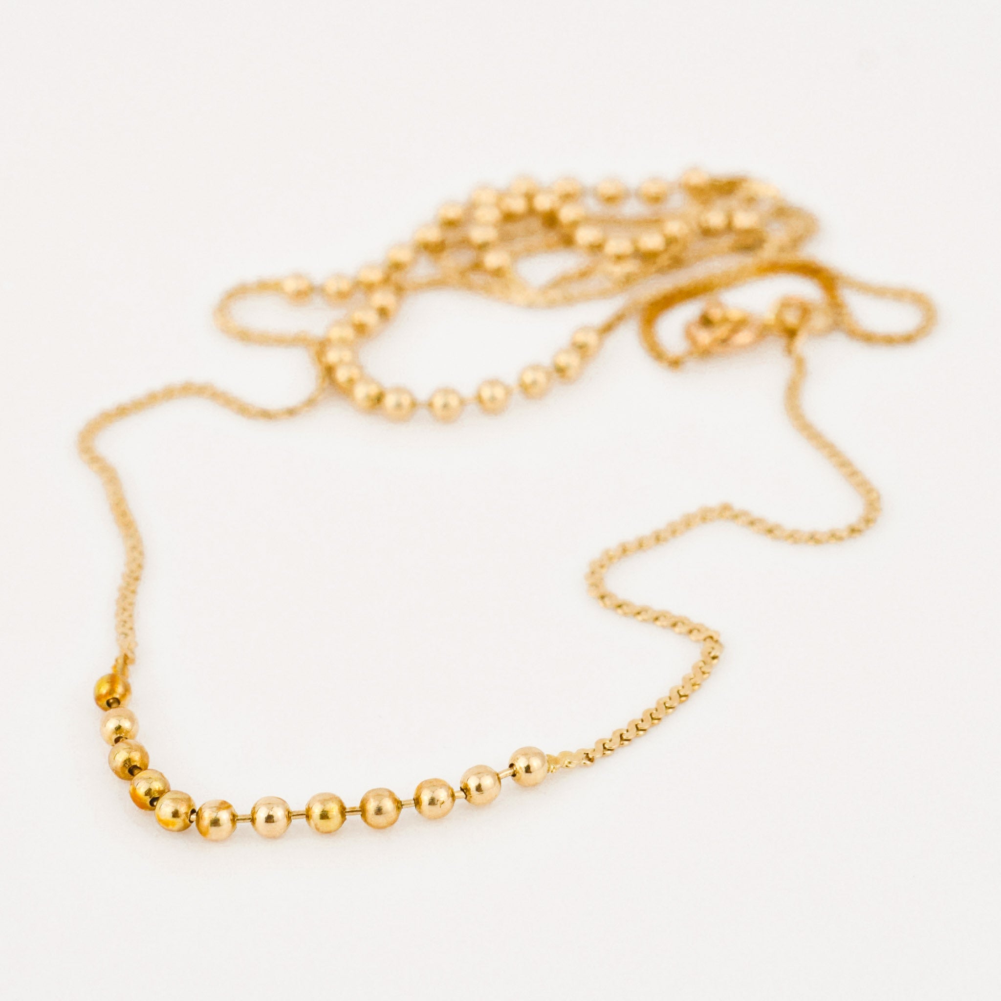 vintage gold static ball necklace