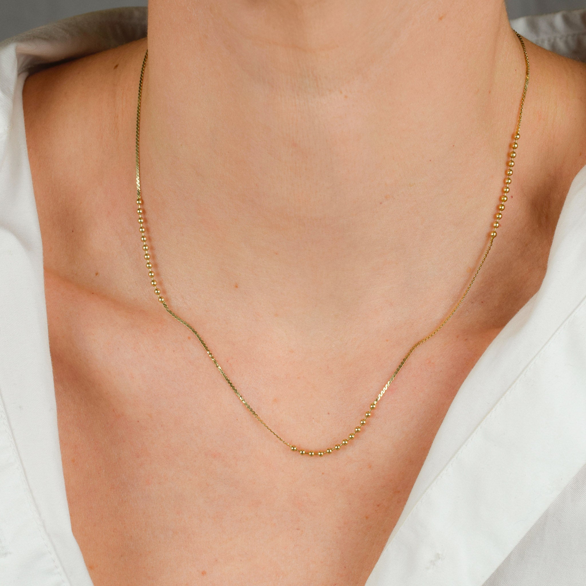 vintage gold static ball necklace