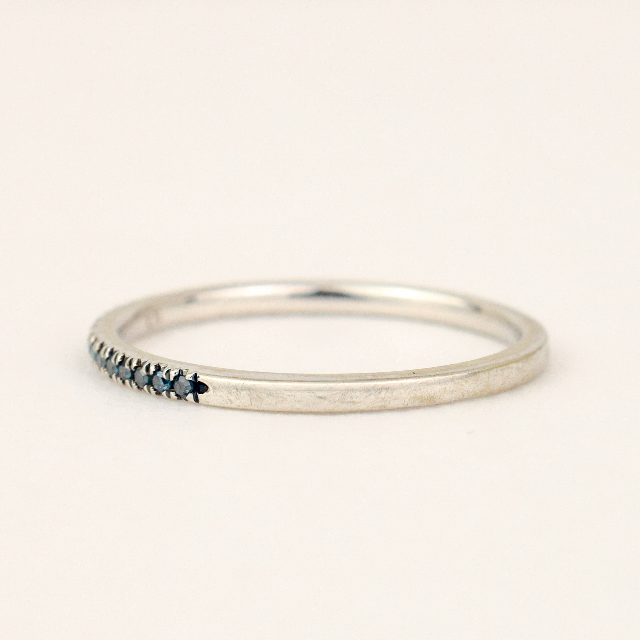 Blue Diamond Half Eternity Band, close-up of the blue diamonds and prong details