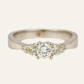 Vintage 14k white gold five stone diamond ring with a round brilliant centre.