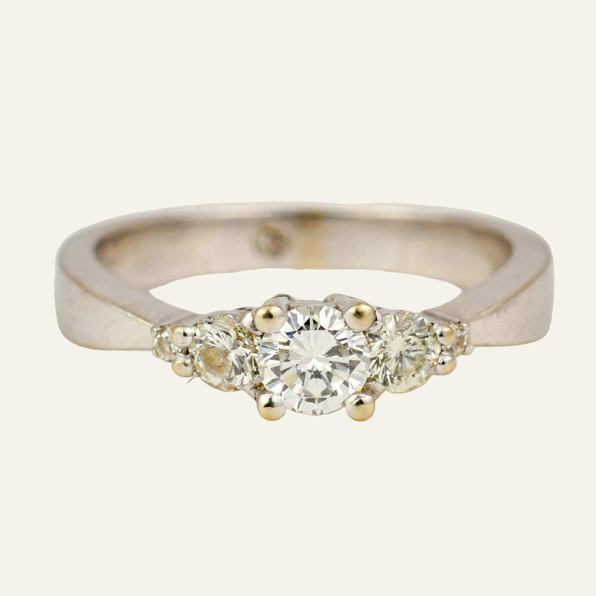 Vintage 14k white gold five stone diamond ring with a round brilliant centre.
