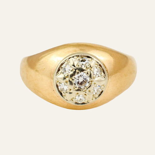Vintage 10k gold dome ring with seven single cut diamonds star-set into a white gold disc.
