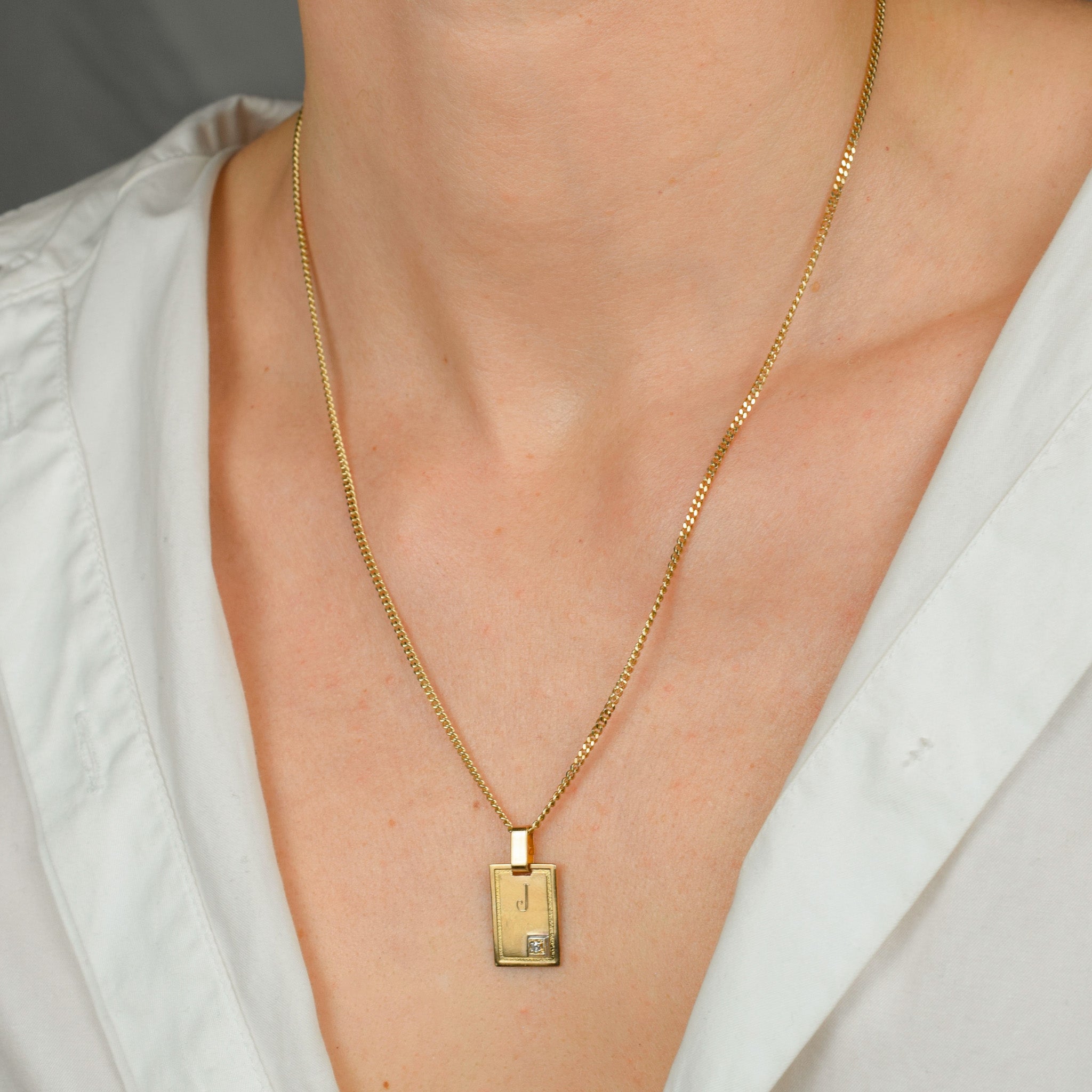 vintage gold 'j' dog tag pendant
