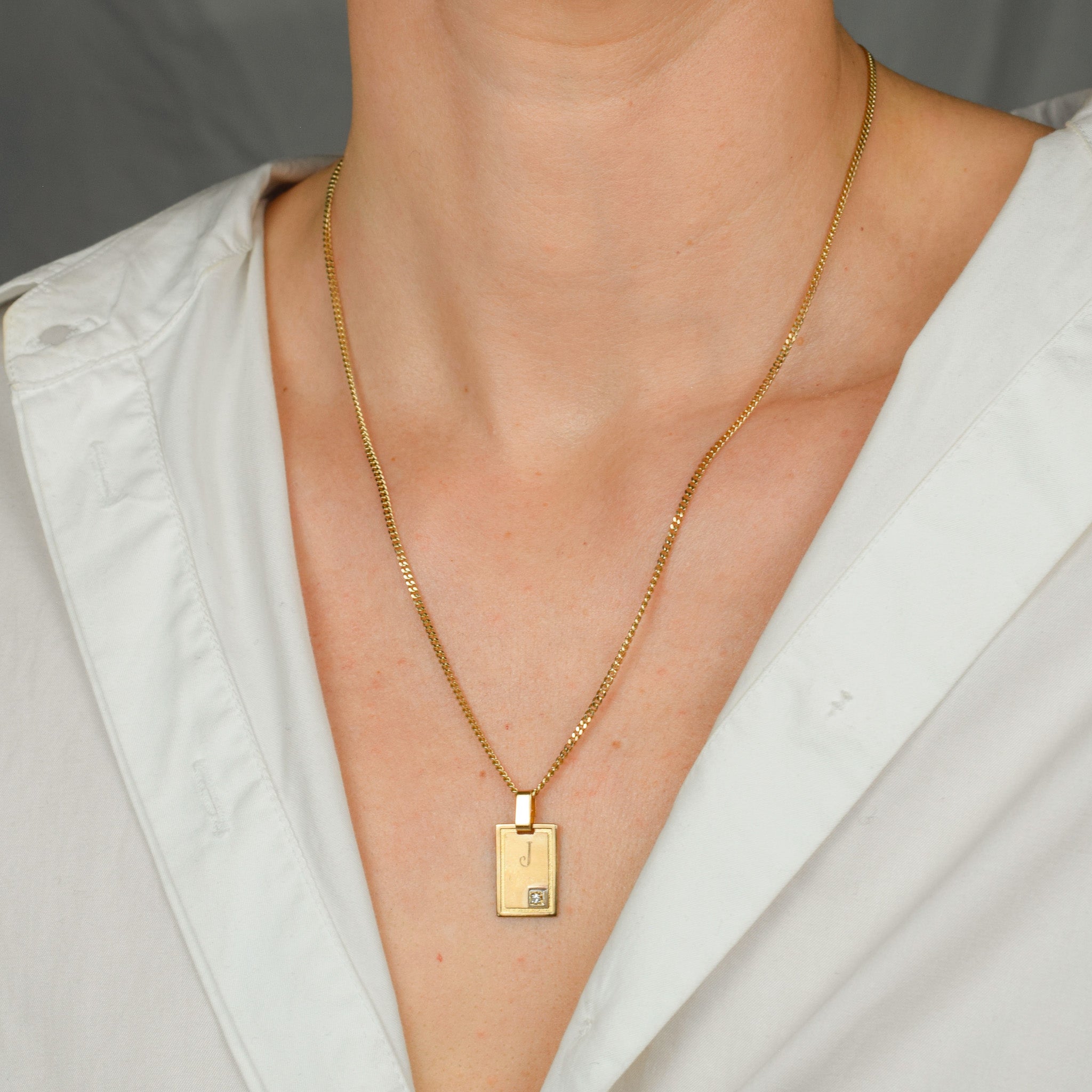 vintage gold 'j' dog tag pendant