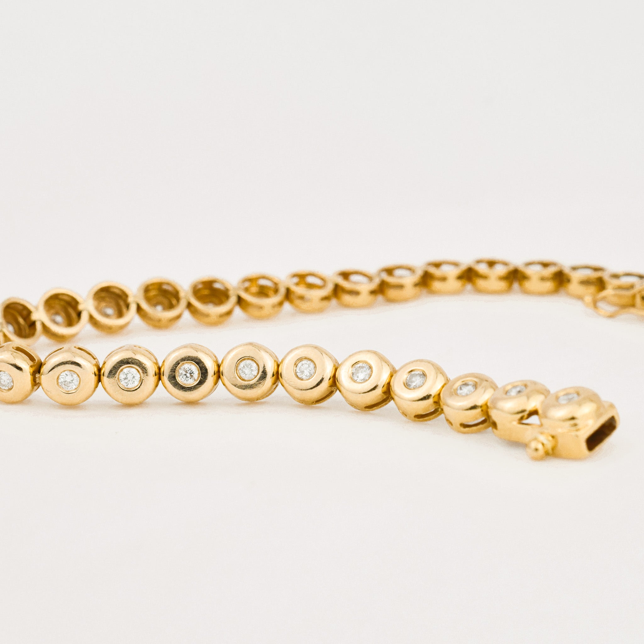 vintage yellow gold bezel set diamond tennis bracelet 