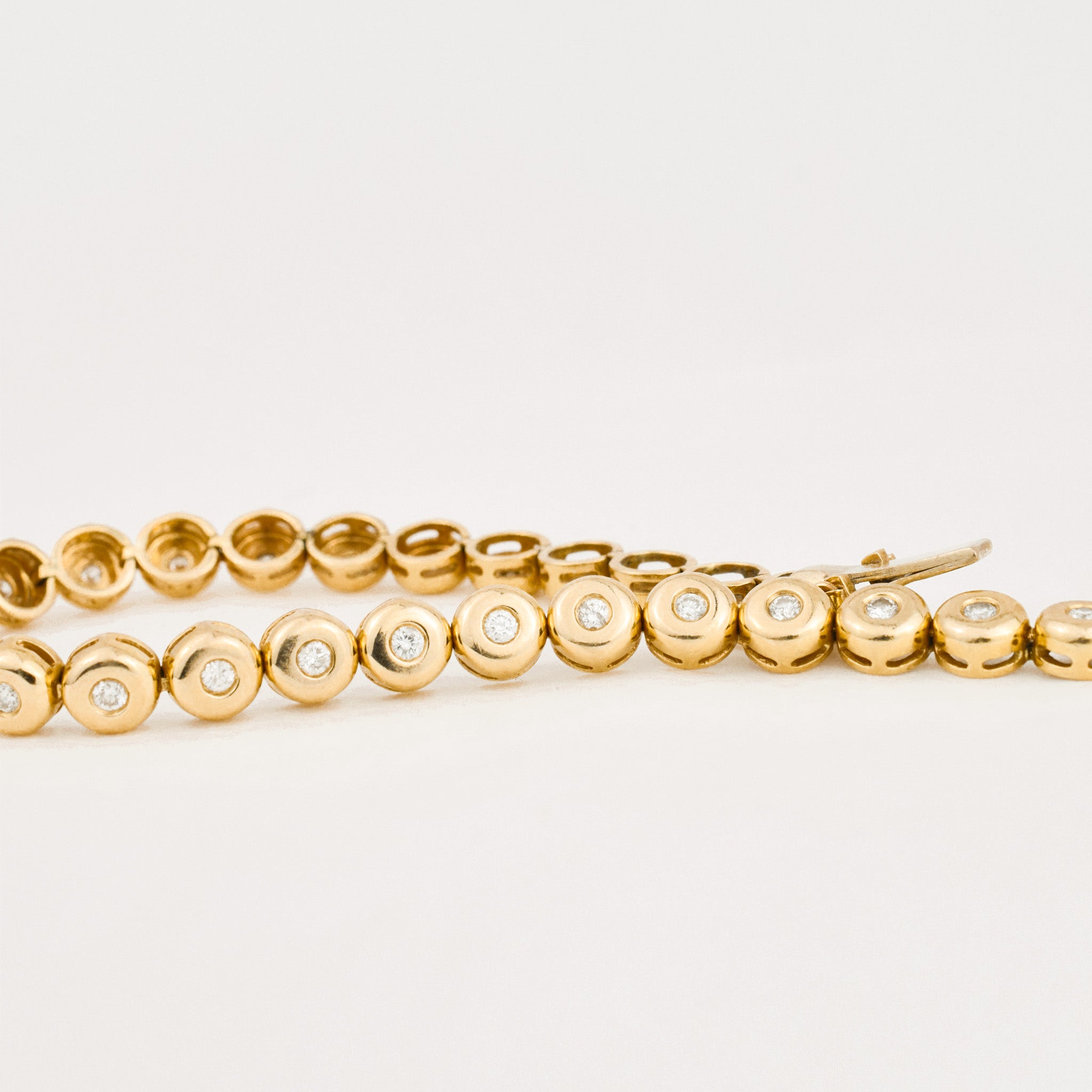 vintage yellow gold bezel set diamond tennis bracelet 